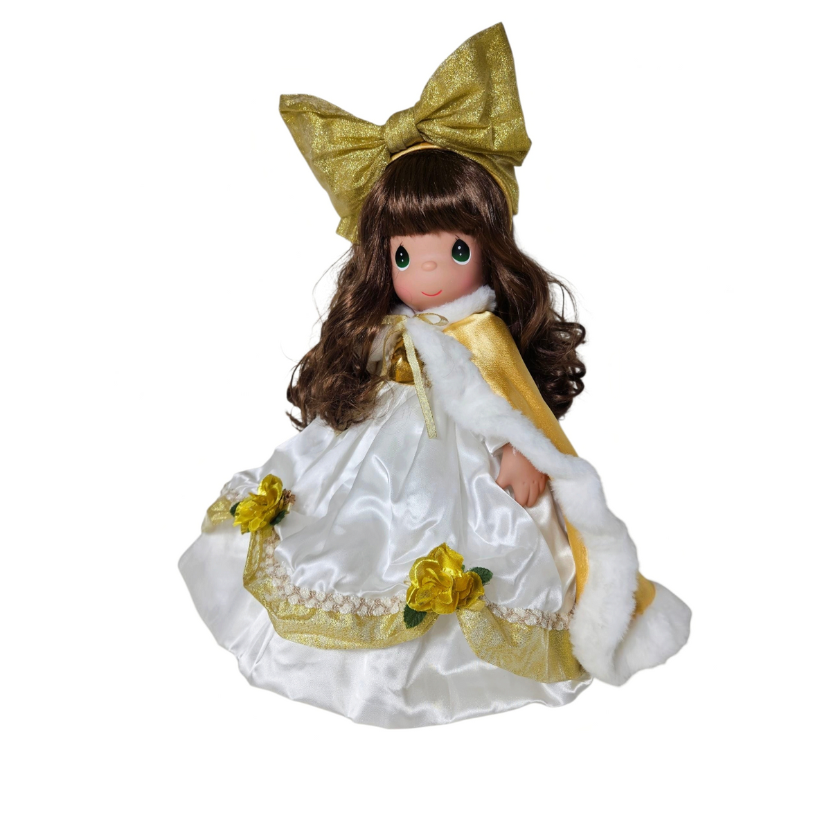 The Doll Maker 2025 Precious Moments annual stocking doll in a white satin dress with gold accents and a large bow.
