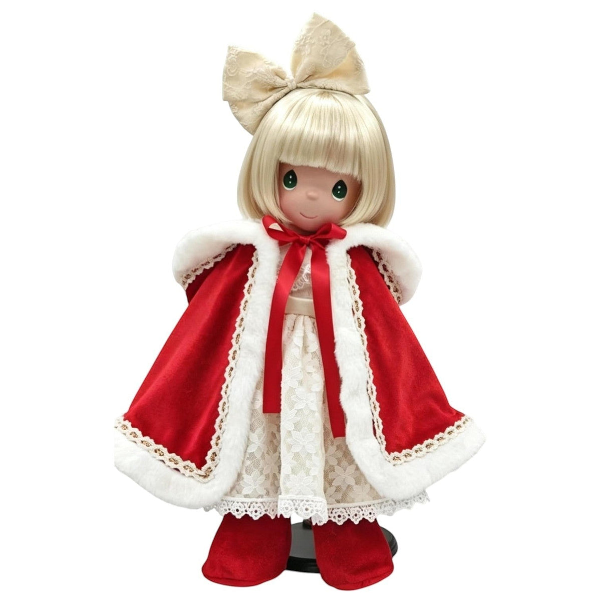 The Doll Maker 2026 Precious Moments Christmas Darling doll in a red velvet cape with white fur trim and lace dress.