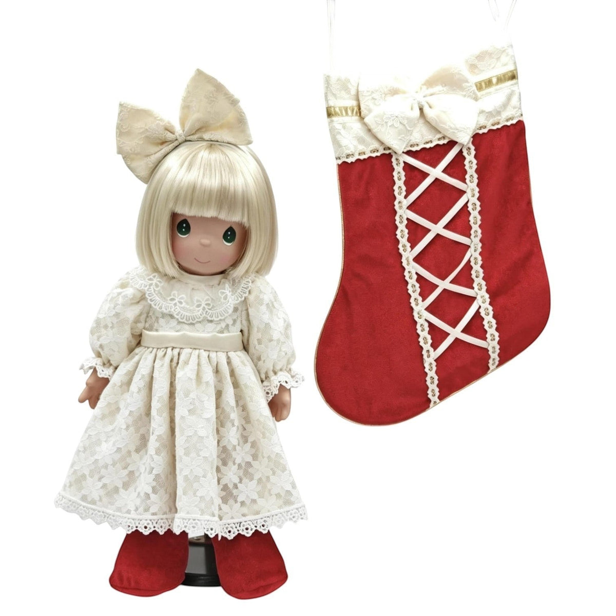 The Doll Maker 2026 Precious Moments Christmas Darling doll in a cream lace dress with a matching red holiday stocking.