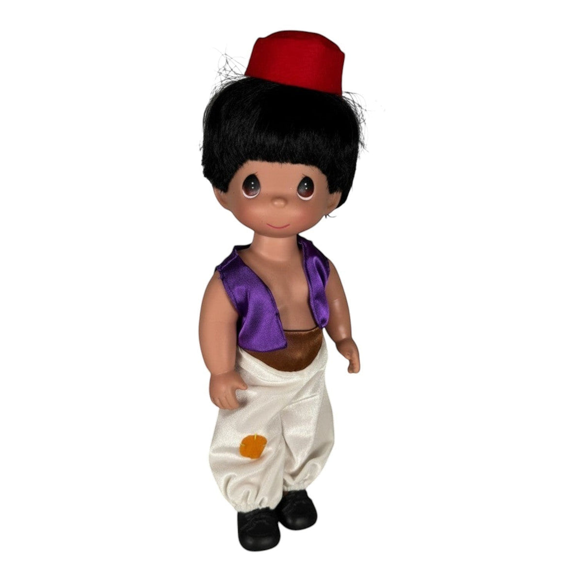 The Doll Maker 12-inch Aladdin doll wearing a red fez, purple vest, and white harem pants
