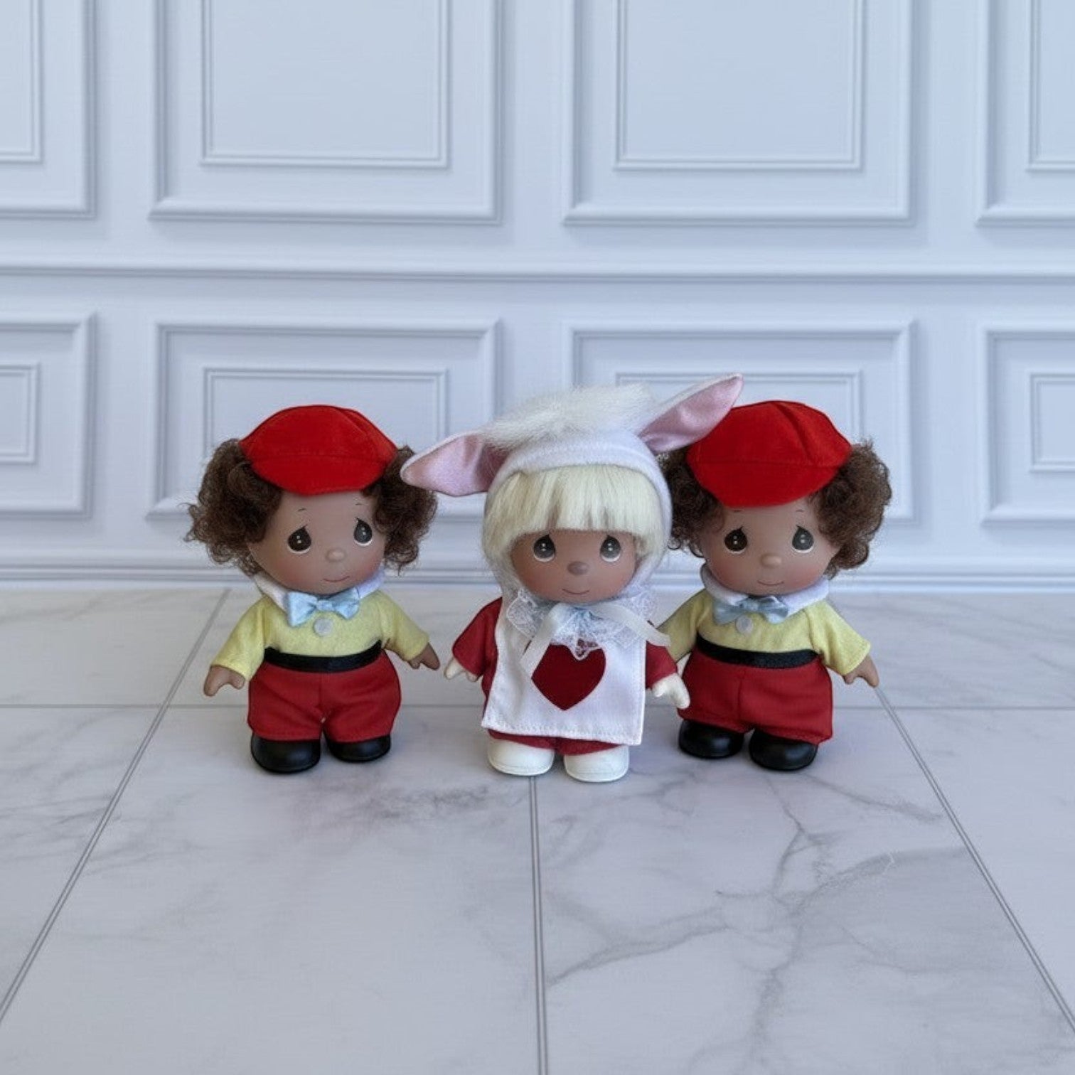 The Doll Maker 5-inch Alice in Wonderland collectible doll set featuring a white rabbit and Tweedledum and Tweedledee.