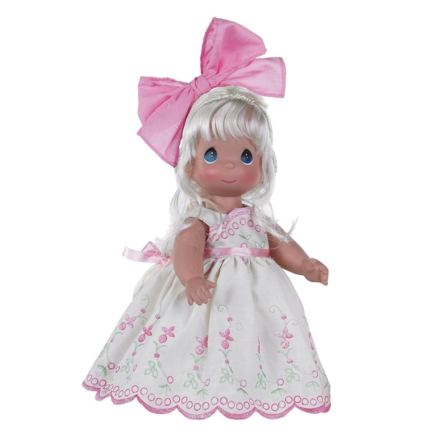 The Doll Maker Always a Tomorrow 12-inch blonde vinyl doll wearing an embroidered dress with pink scalloped trim.