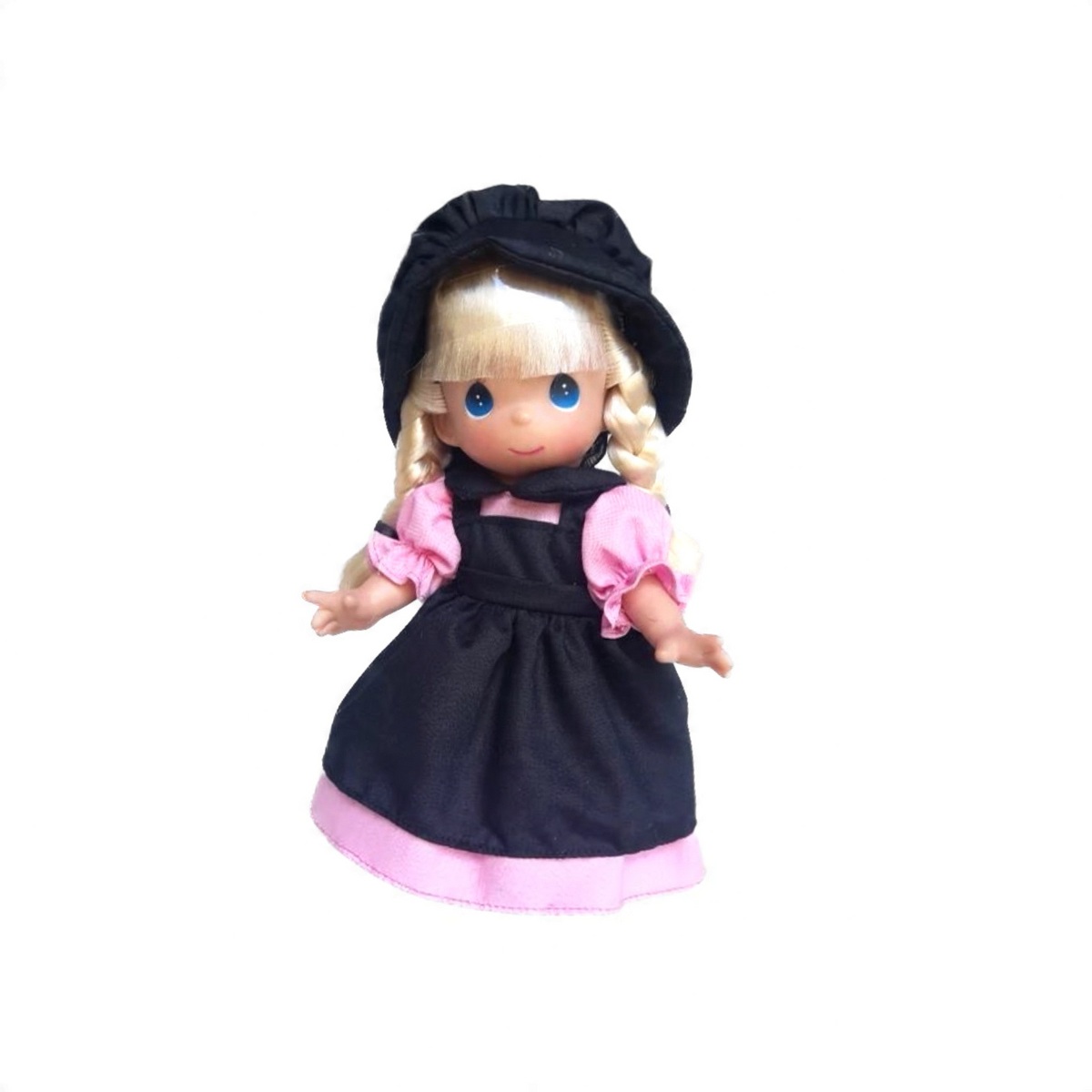 The Doll Maker 9-inch Amish girl doll with blonde braided hair, wearing a black bonnet, black apron, and pink dress.