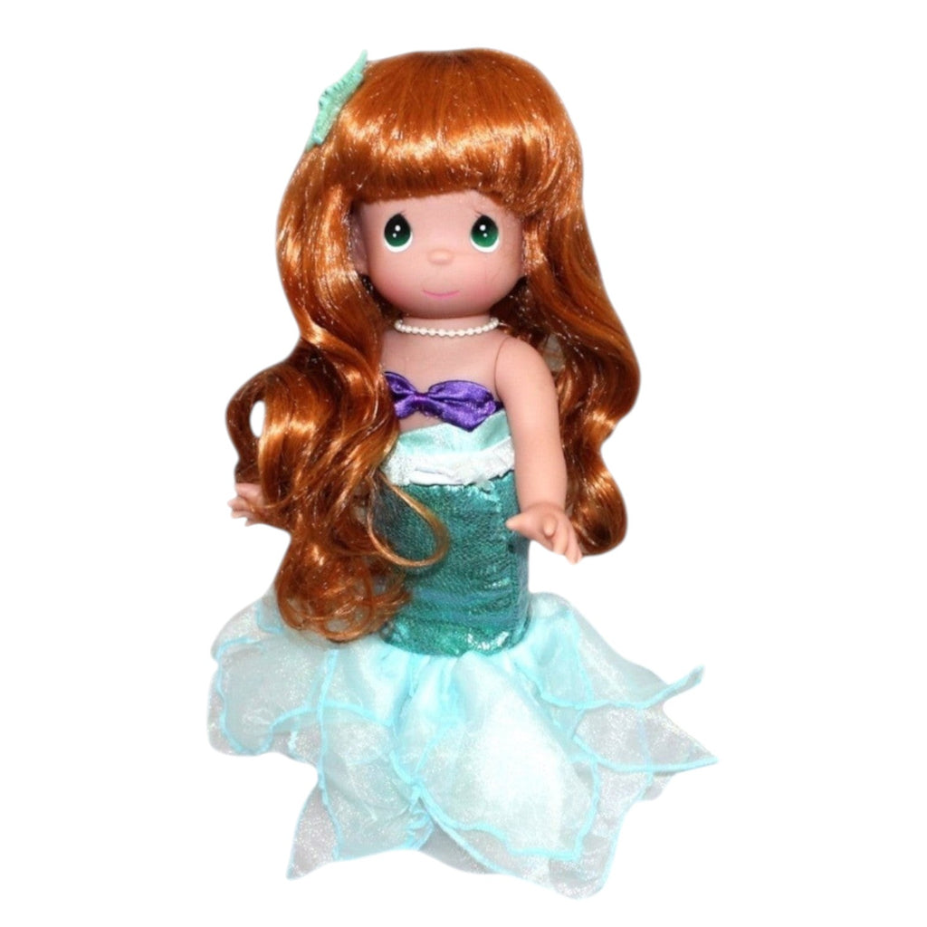 The Doll Maker 12-inch Ariel mermaid doll with long red hair, purple seashell top, and shimmering teal tail.