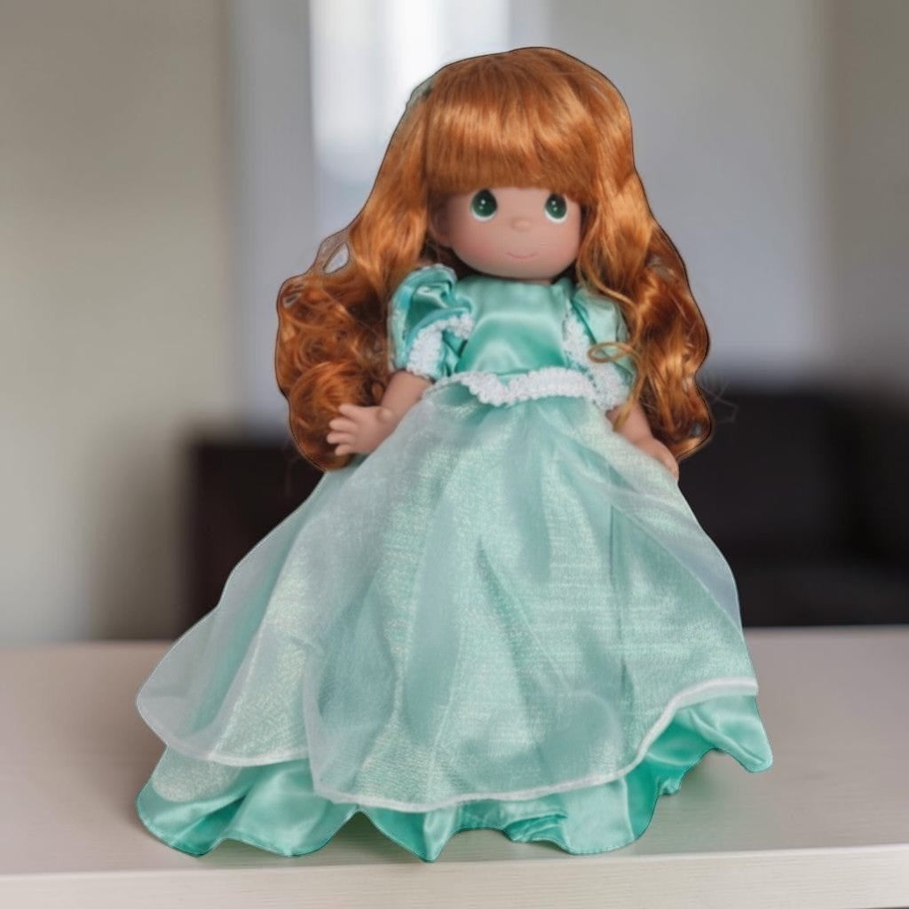 The Doll Maker Ariel collectible doll with long wavy red hair wearing a shimmering teal gown with white lace trim
