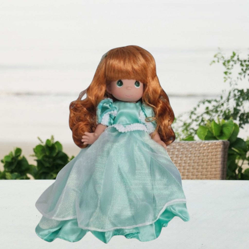 The Doll Maker Ariel collectible doll with long wavy red hair wearing a shimmering teal gown with white lace trim
