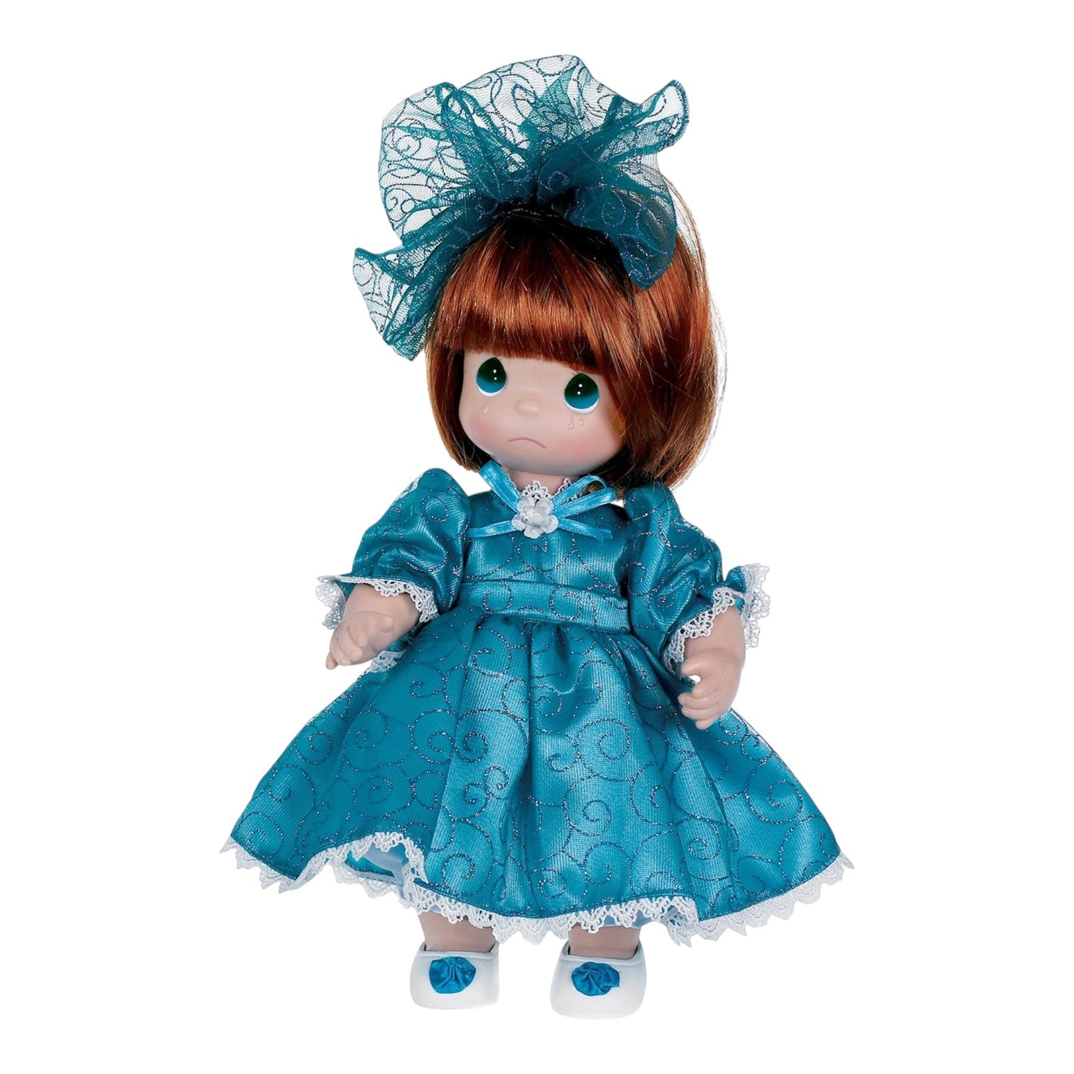 The Doll Maker 12 inch vinyl doll with auburn hair wearing a teal glittery dress and a matching lace hair bow.