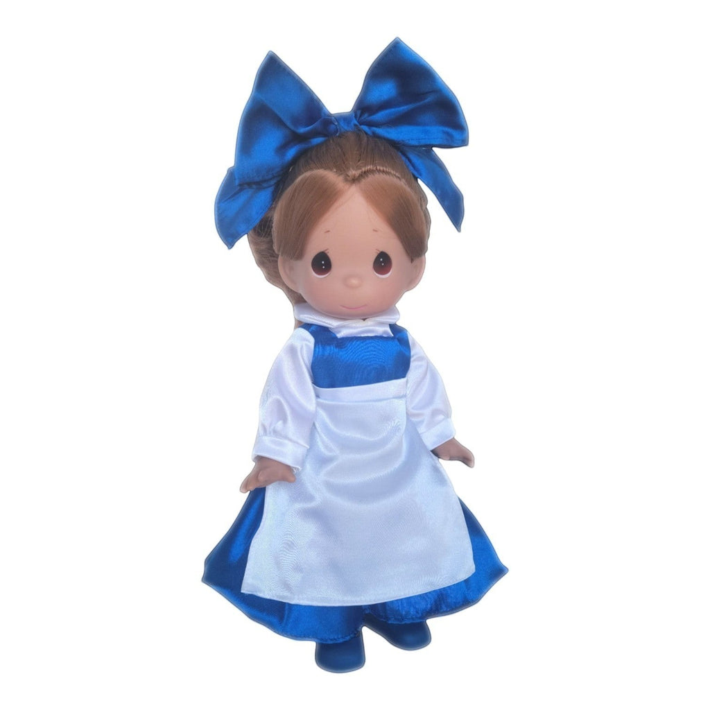 The Doll Maker 12-inch Belle doll wearing a blue dress with a white apron and a large matching blue hair bow.