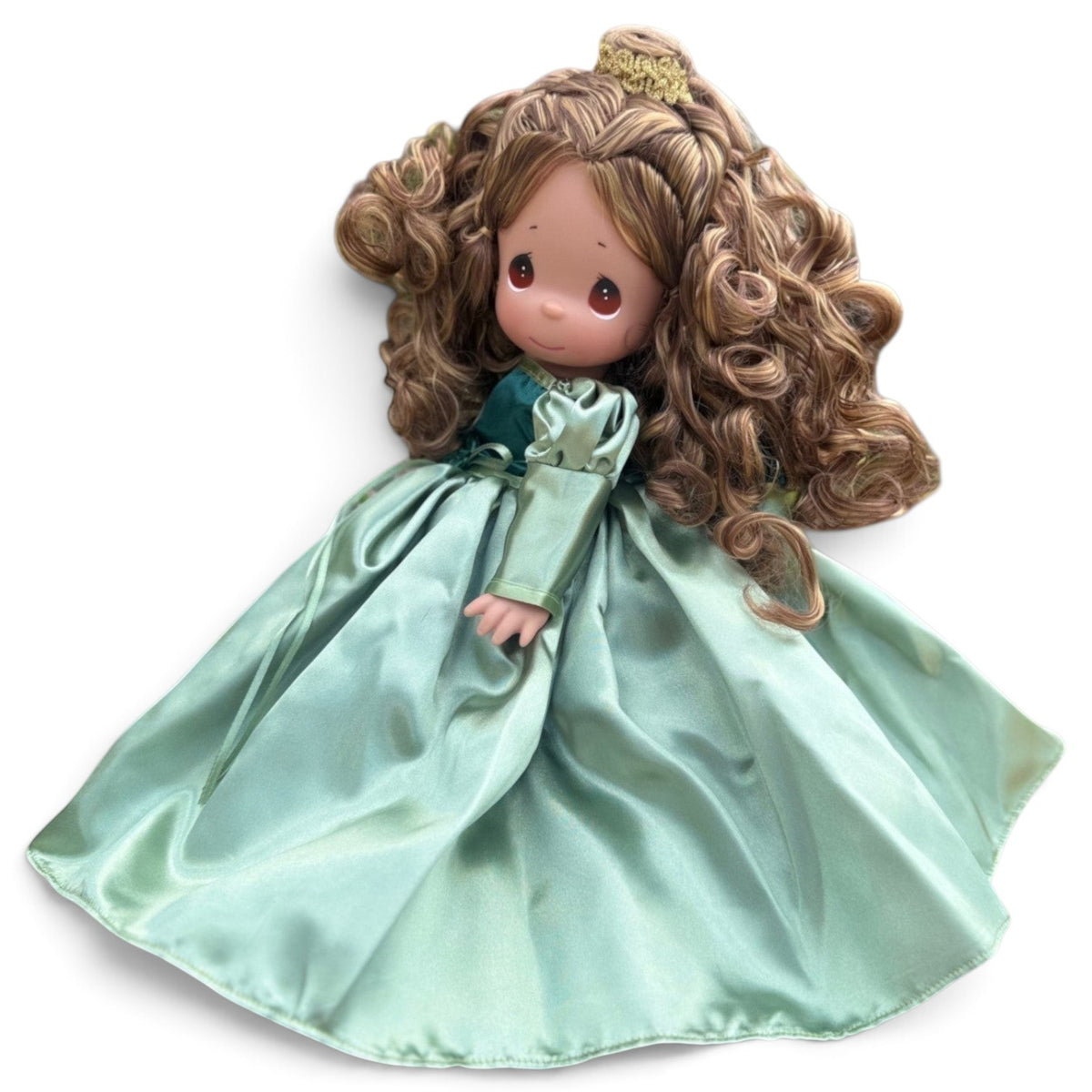 The Doll Maker 12-inch Belle doll with curly brown hair, tear drop eyes, and a shimmering sage green satin gown.
