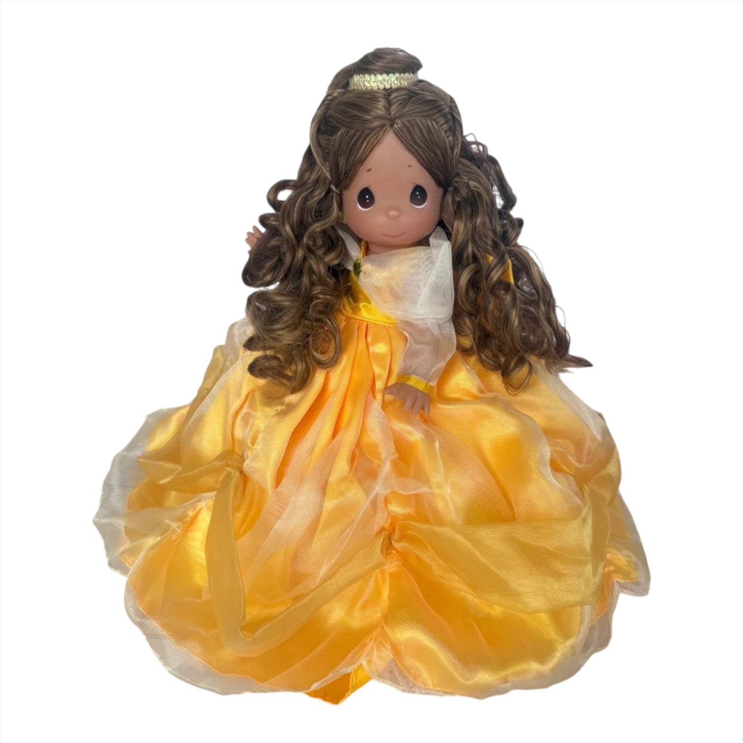 The Doll Maker 12-inch Belle vinyl doll wearing a detailed yellow gown with elegant draping and curly brown hair.