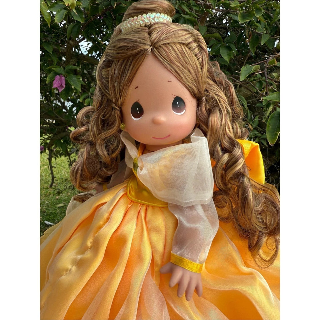 The Doll Maker 12-inch Belle doll wearing a yellow ball gown with sheer sleeves and long wavy brown hair