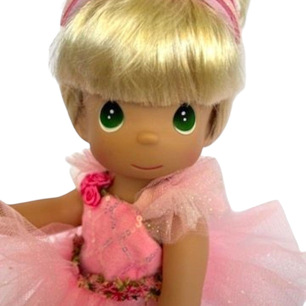 The Doll Maker 12-inch blonde Precious Moments ballerina doll wearing a pink tutu with floral accents