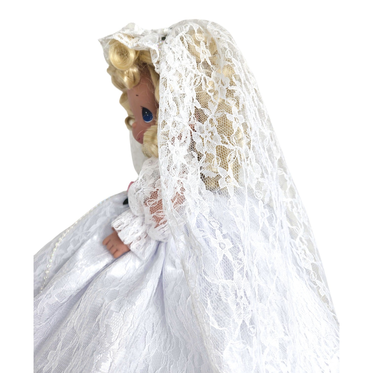 The Doll Maker Fairytale Come True blonde bride doll wearing a white lace wedding dress and veil, side profile view.