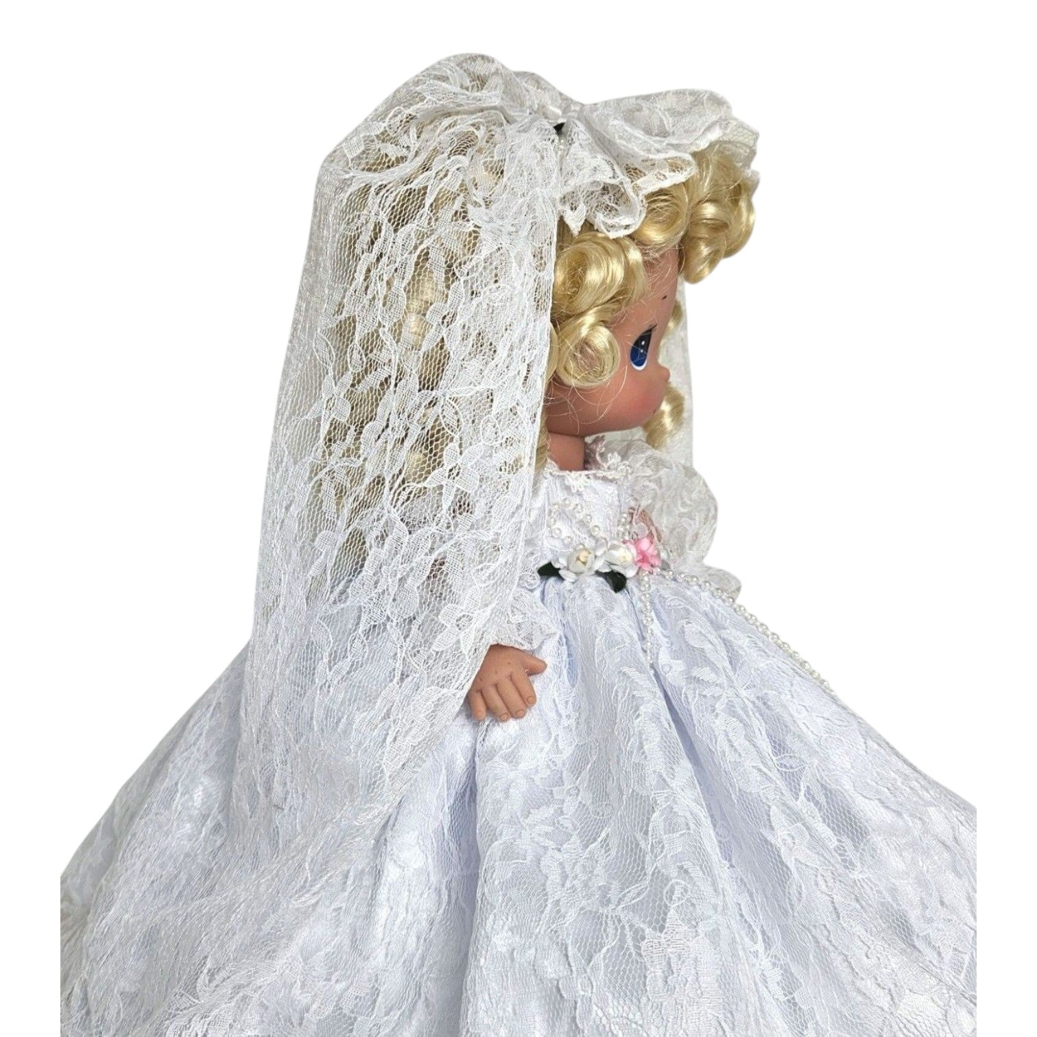 The Doll Maker Fairytale Come True blonde bride doll wearing a white lace wedding dress and veil, side profile view.