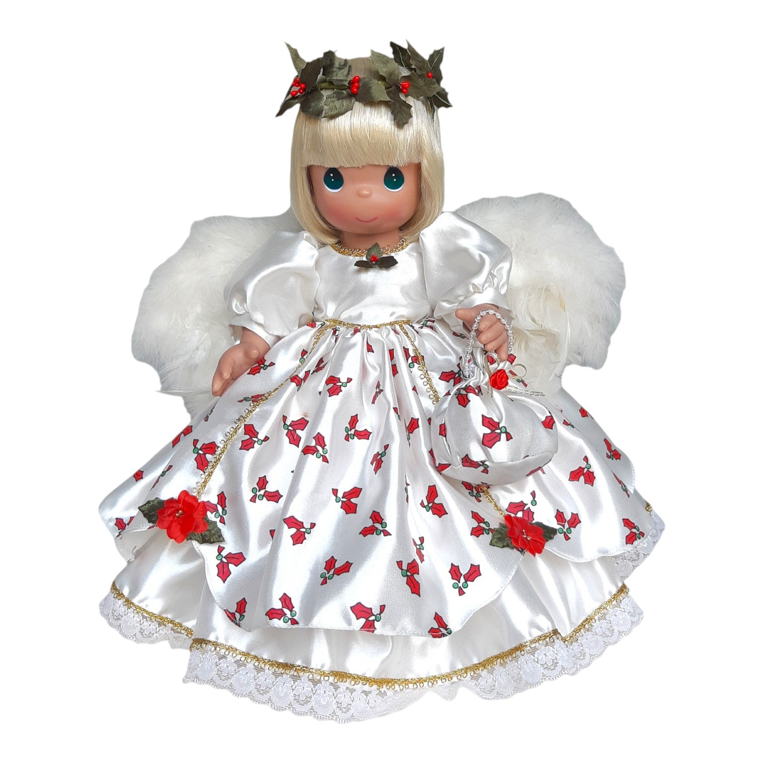 The Doll Maker 12-inch blonde Christmas angel doll wearing a white satin holly print dress with white faux fur wings.