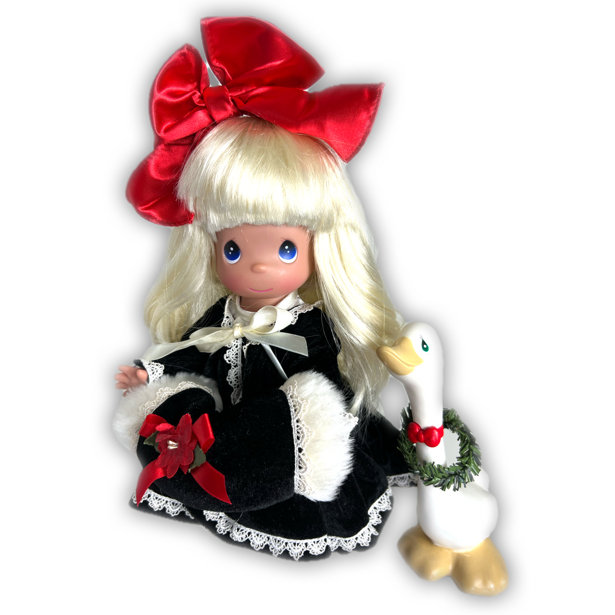 Precious Moments dolls designed by Linda Rick The Doll Maker Precious Moments 12-inch blonde doll in a black velvet Christmas dress with a toy goose.