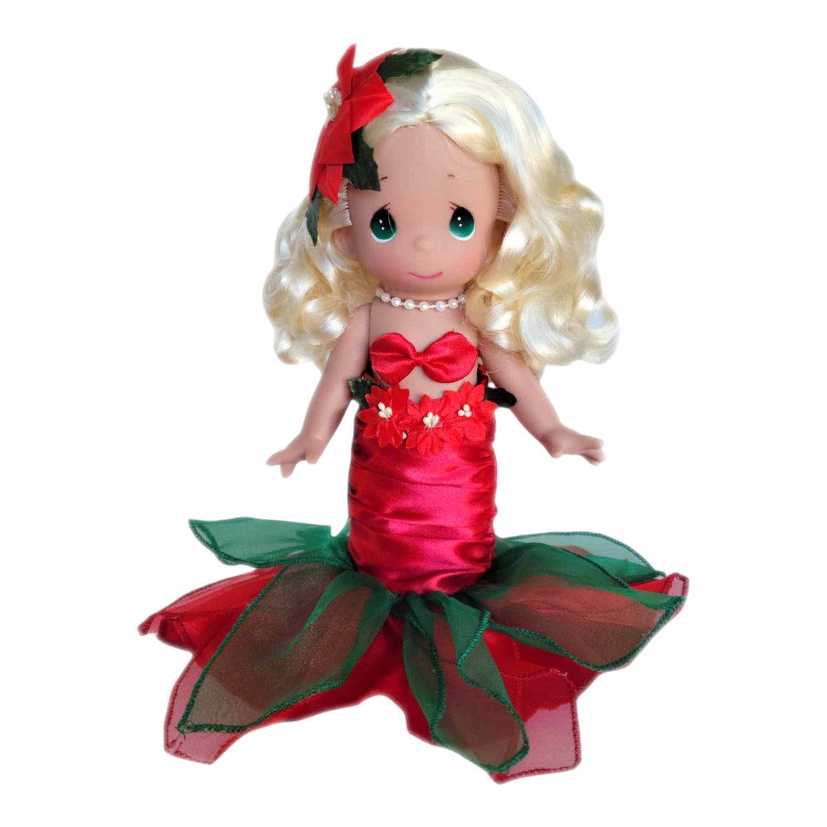The Doll Maker 9-inch blonde Christmas mermaid vinyl doll with red and green festive outfit and poinsettia hair clip.