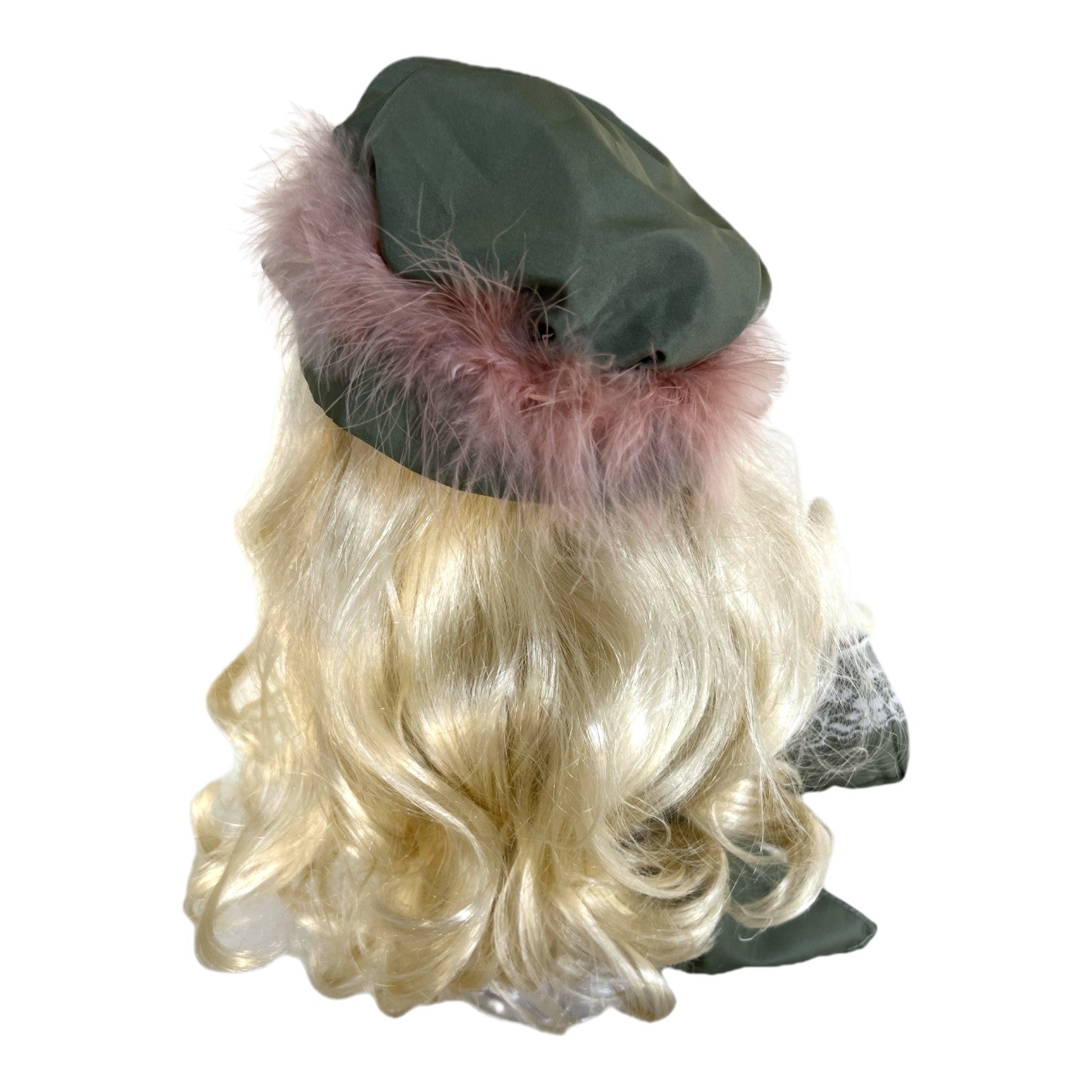 The Doll Maker Shop Til You Drop doll featuring long blonde curly hair and a green hat with pink faux fur trim