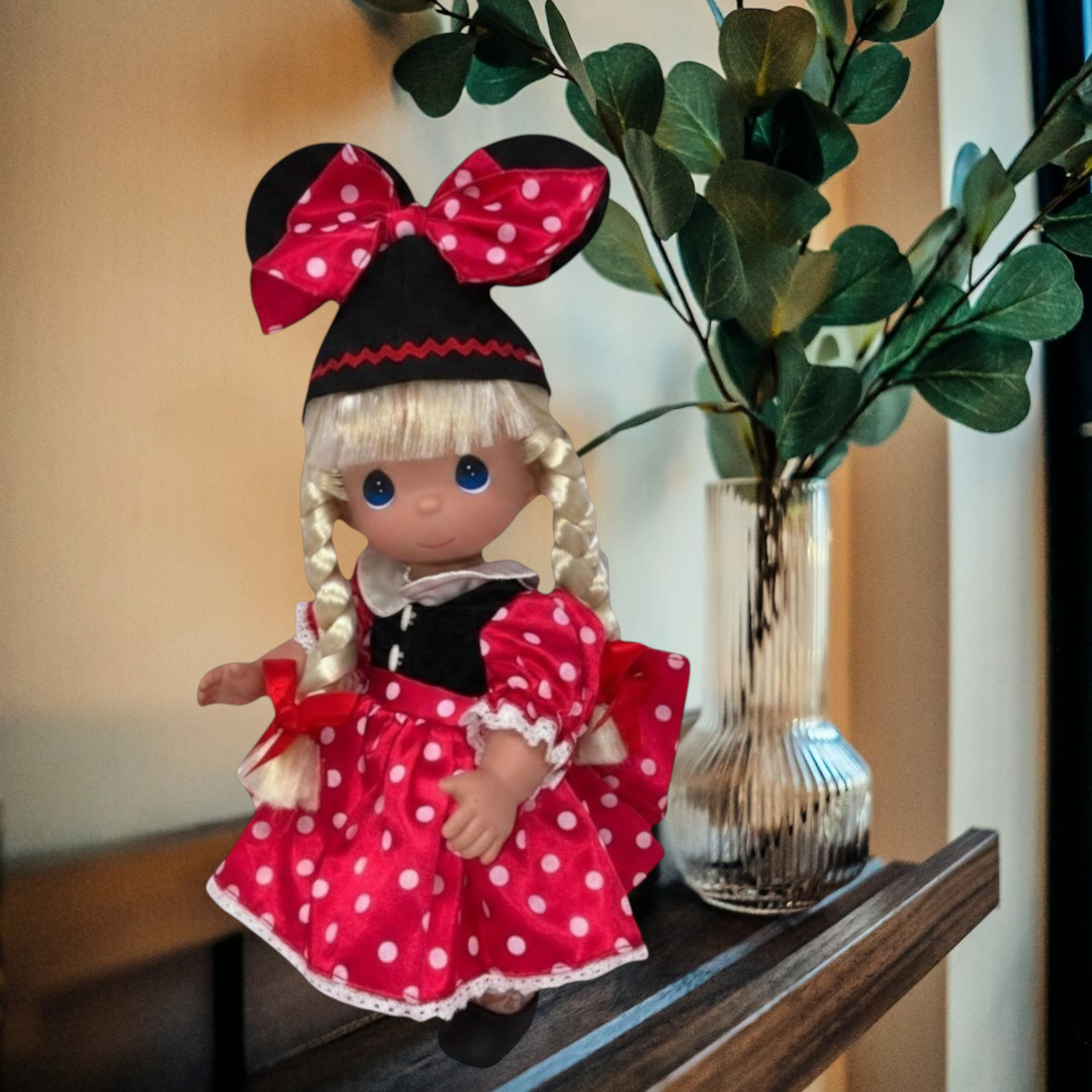 The Doll Maker 12-inch blonde Minnie Mouseketeer collectible doll wearing a red polka dot dress and mouse ear hat.