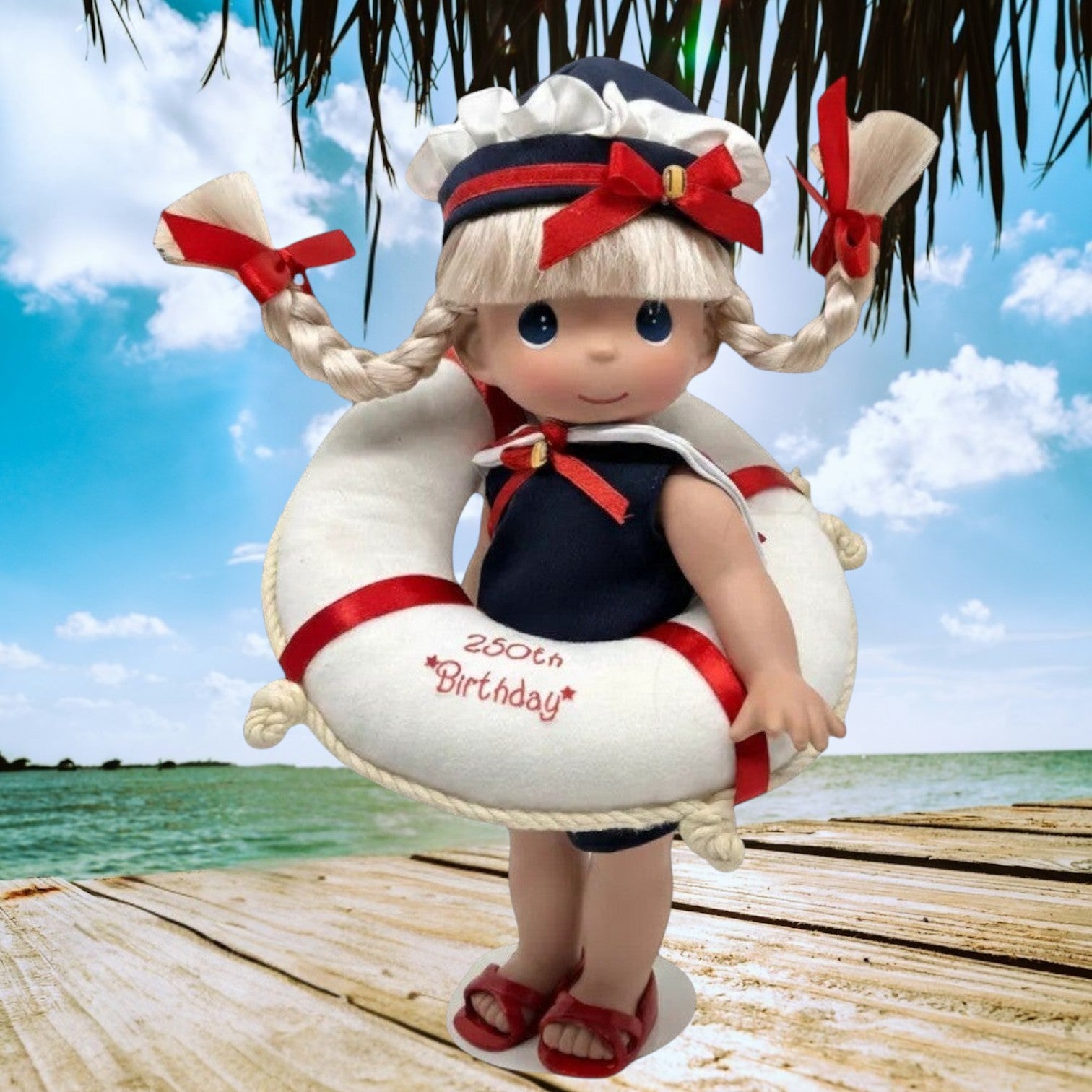 The Doll Maker 12-inch blonde doll wearing a nautical outfit and life saver for the USA 250th birthday celebration.