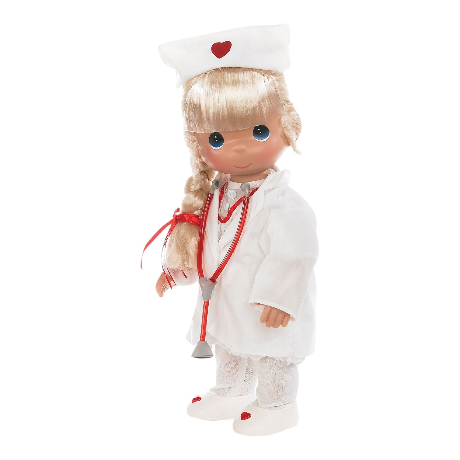 The Doll Maker 12-inch blonde nurse doll wearing a white uniform, cap with red heart, and a red toy stethoscope.