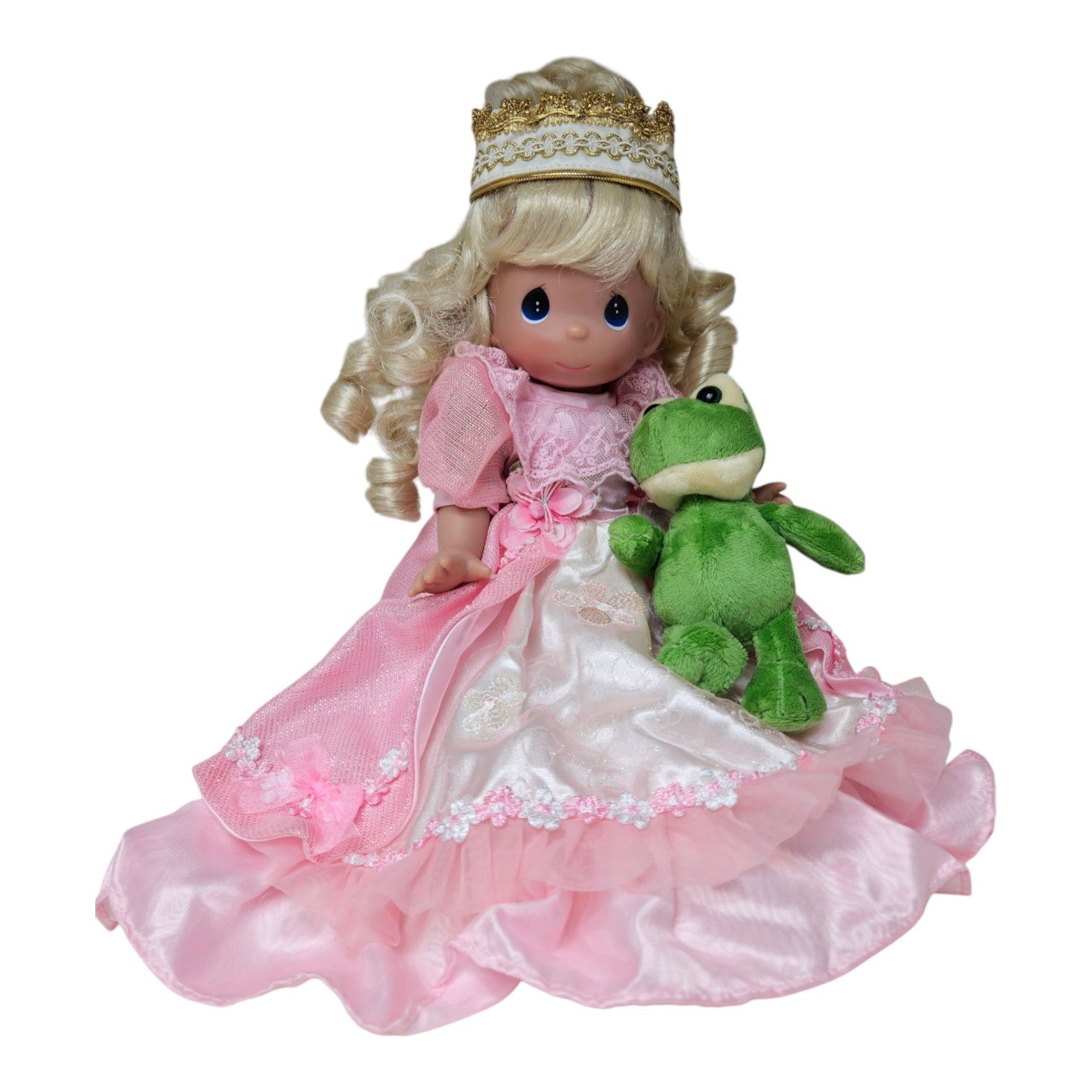 The Doll Maker 12-inch blonde curly vinyl princess doll wearing a pink gown, tiara, and holding a plush green frog.