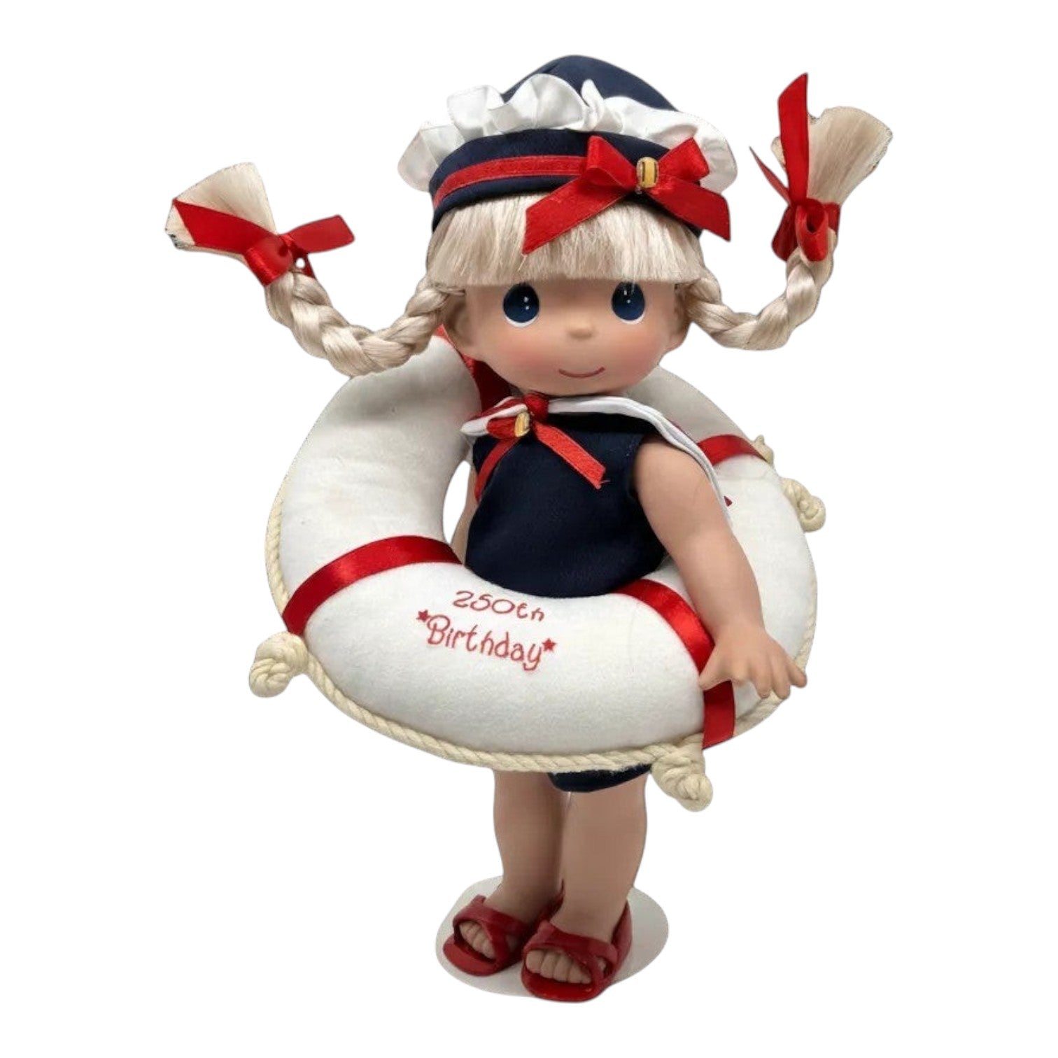 The Doll Maker 12-inch blonde doll in a navy sailor outfit with a life saver ring celebrating USA 250th birthday