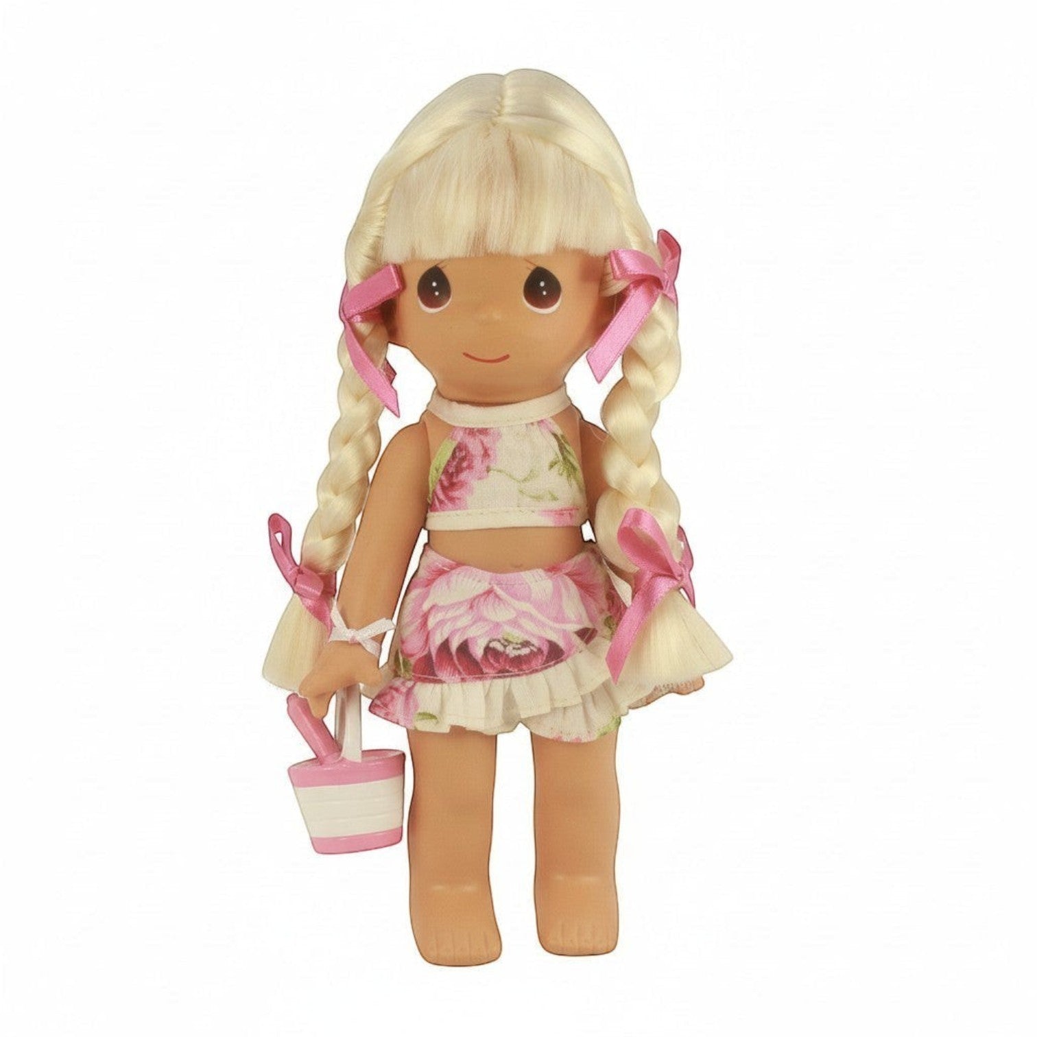 The Doll Maker 9 inch Precious Moments blonde doll wearing a floral two-piece outfit with pink ribbons and a sand pail.