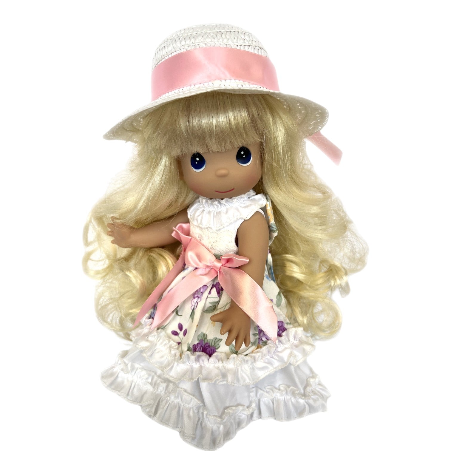 The Doll Maker Precious Moments 12-inch blonde vinyl doll wearing a floral dress and a straw hat with a pink ribbon.