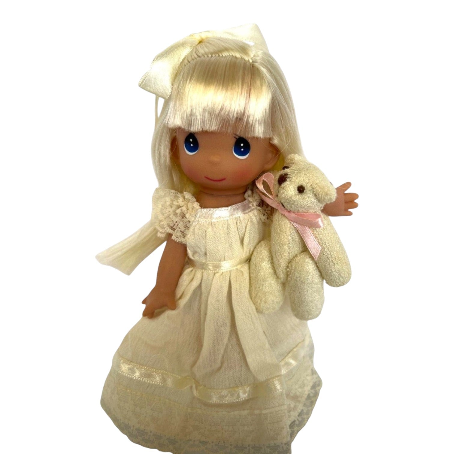 The Doll Maker Cherish Me Always 7-inch blonde vinyl doll wearing an ivory lace gown and holding a small teddy bear.