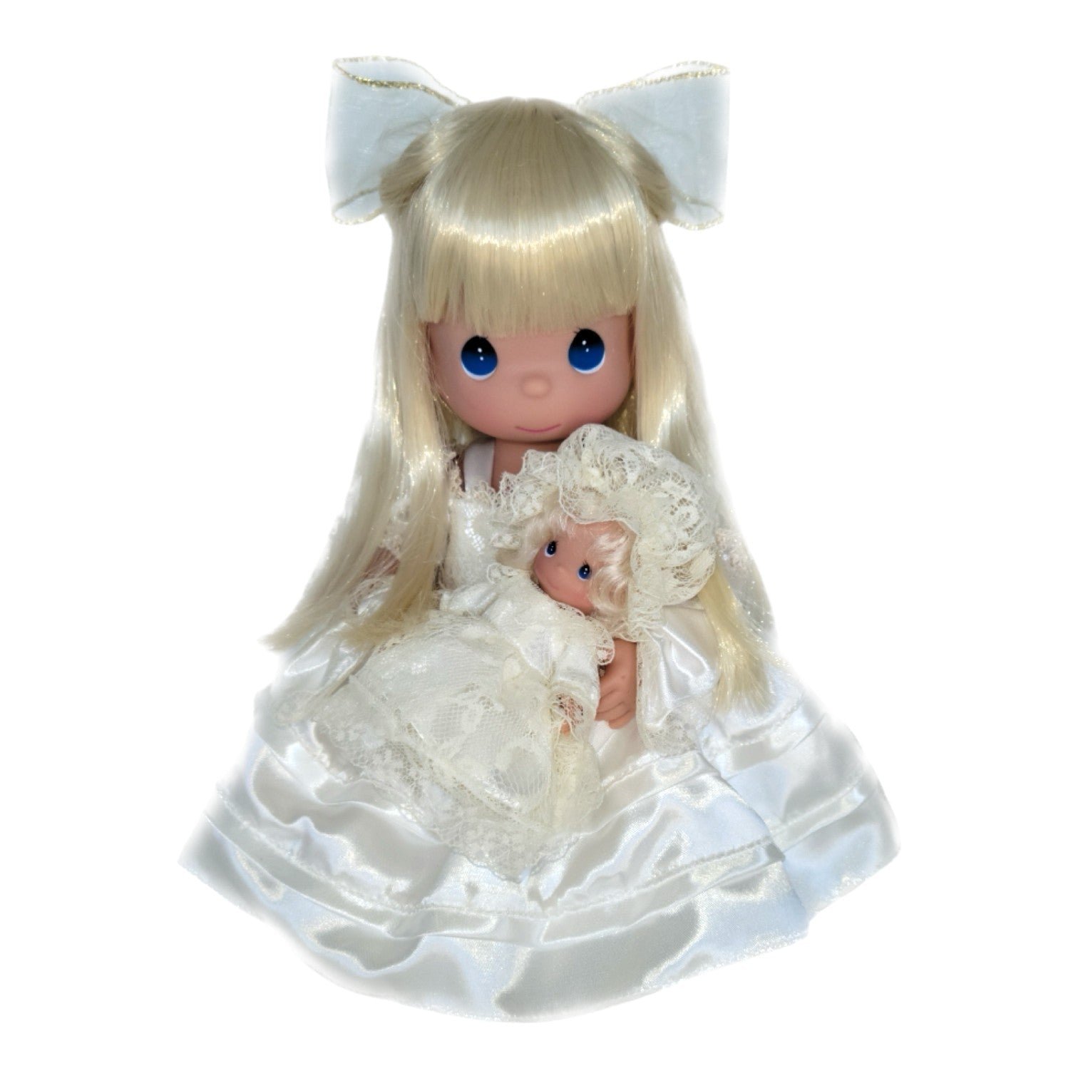The Doll Maker A Mother’s Love 12-inch blonde vinyl doll wearing a white satin dress and holding a small doll.