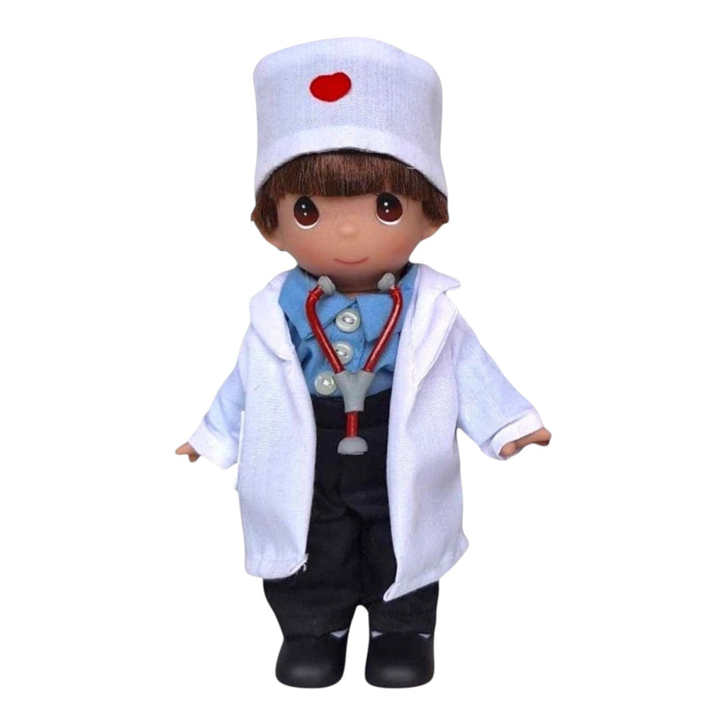 The Doll Maker 7-inch Caring Heart boy doctor doll wearing a white lab coat, blue shirt, and stethoscope.