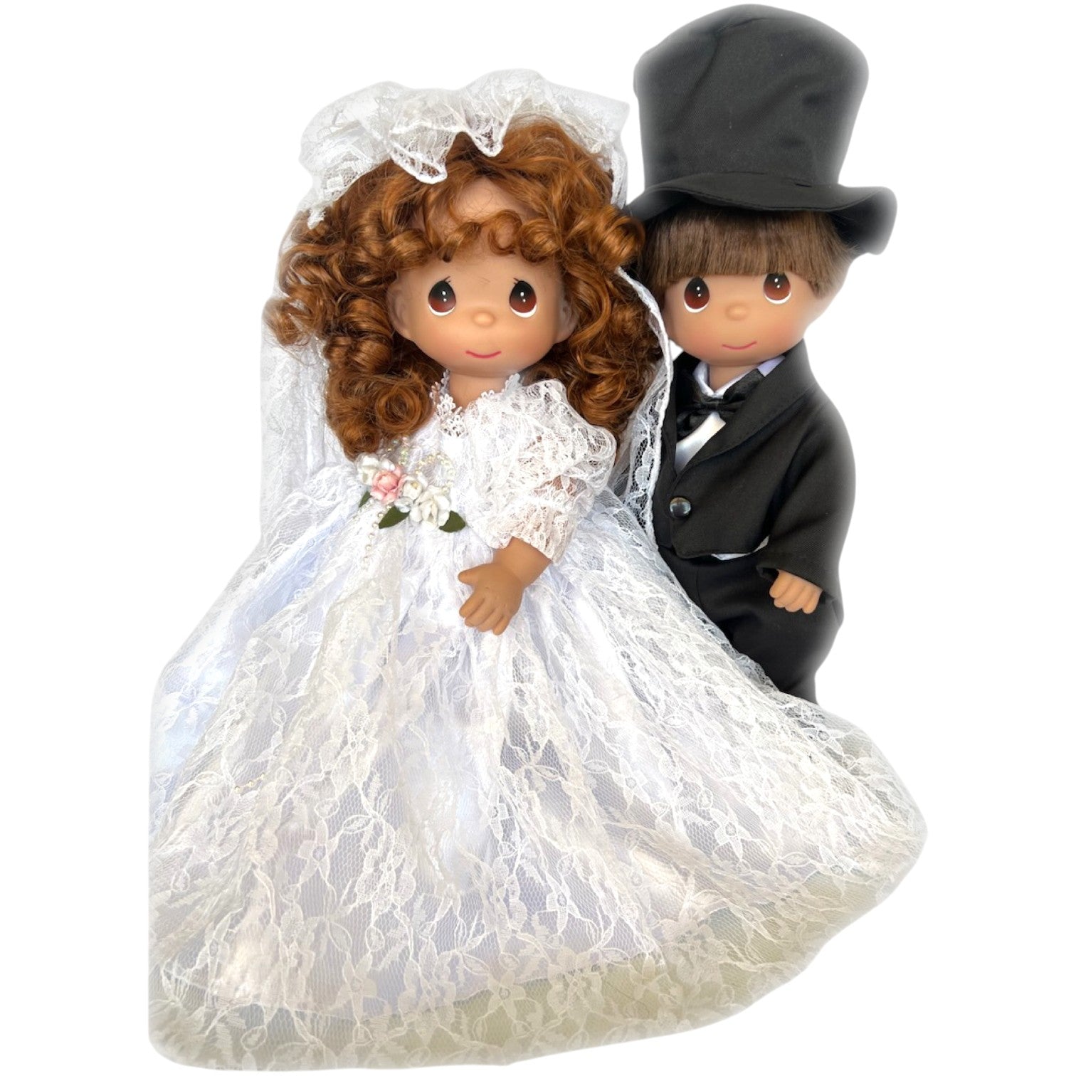 The Doll Maker Fairytale Come True bride and groom vinyl dolls in wedding attire with lace veil and top hat.
