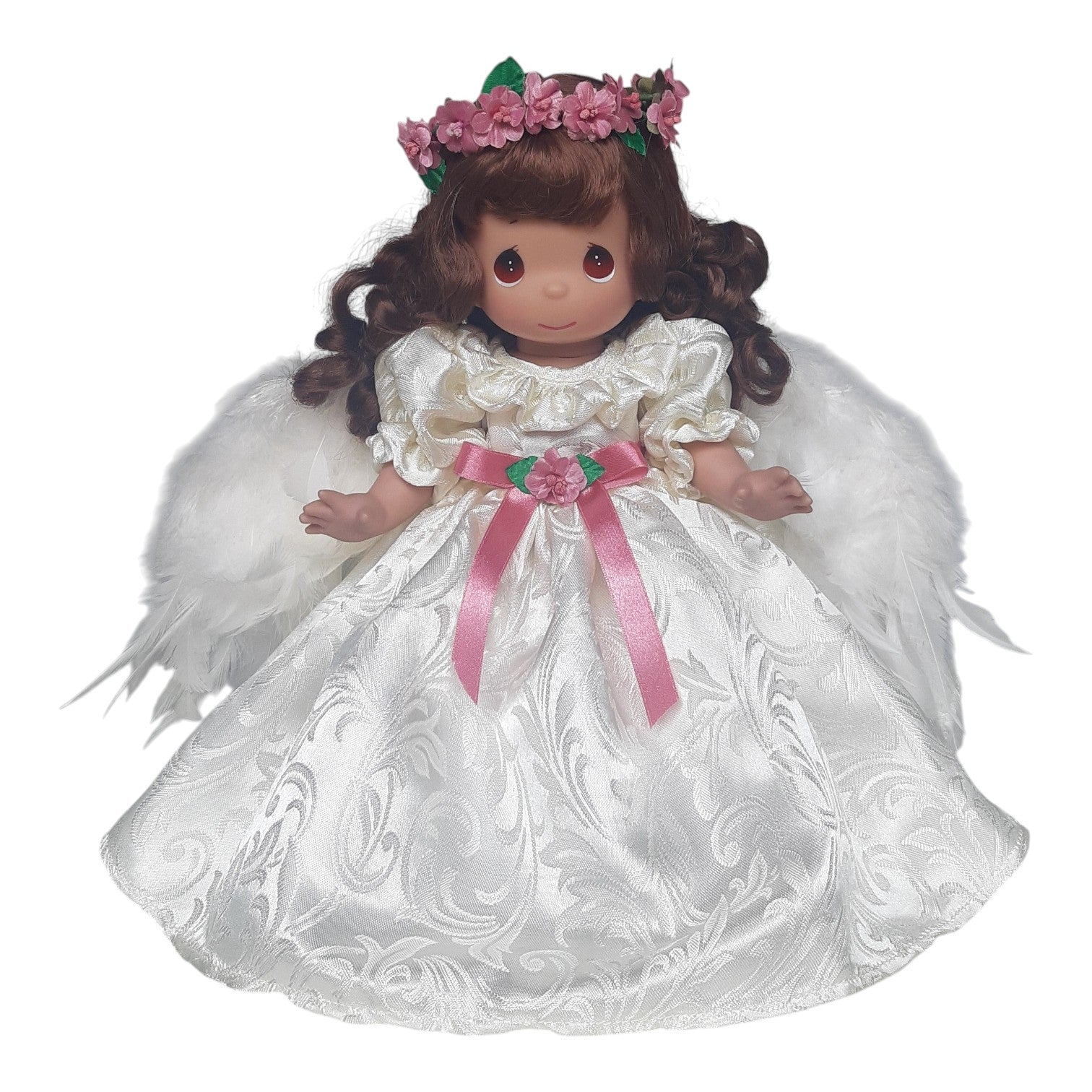 The Doll Maker 16-inch brunette angel doll wearing a white satin dress with pink ribbon and a floral crown.
