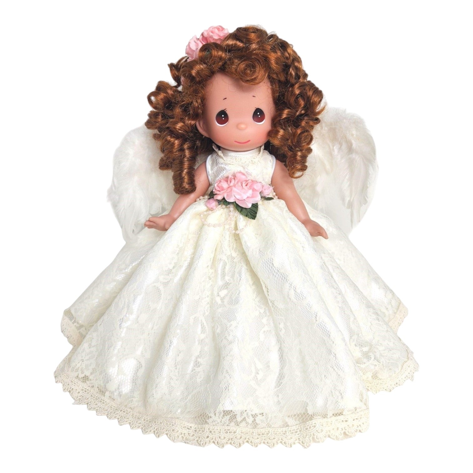 The Doll Maker 12-inch brunette angel doll wearing a white lace dress with pink flowers and feathered wings.