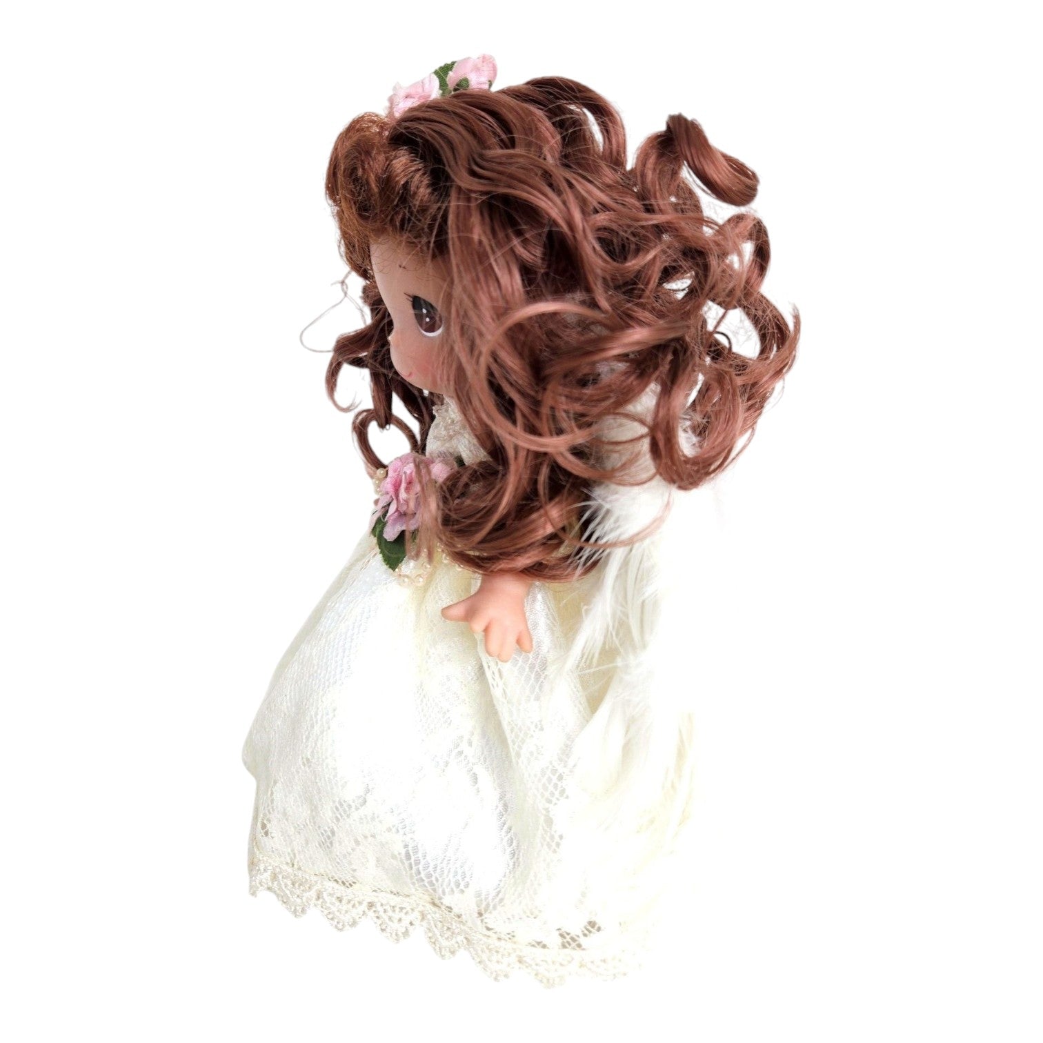 The Doll Maker 9-inch brunette angel doll wearing a white lace dress with feathered wings and pink floral accents.