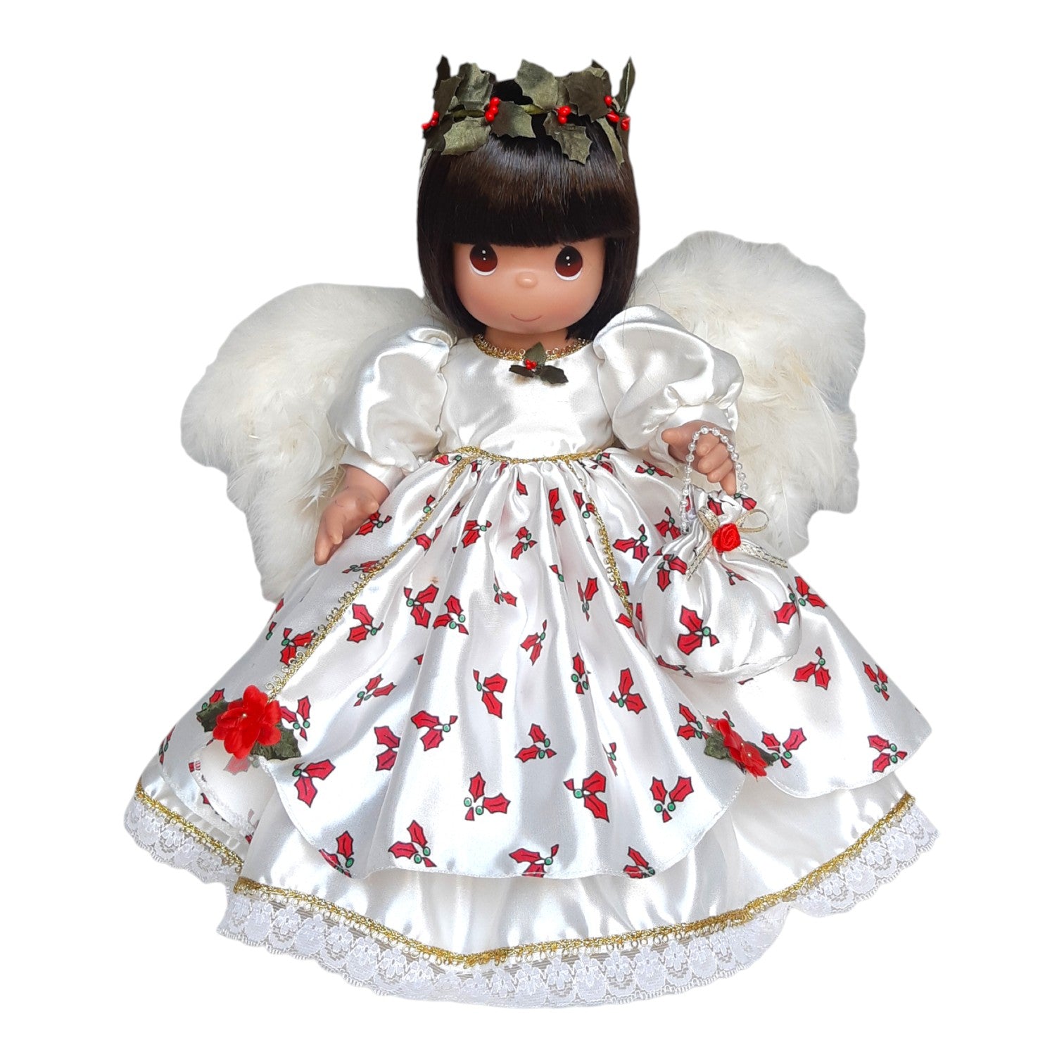The Doll Maker Silent Night Holly Night brunette angel doll wearing a white satin dress with holly print and wings.