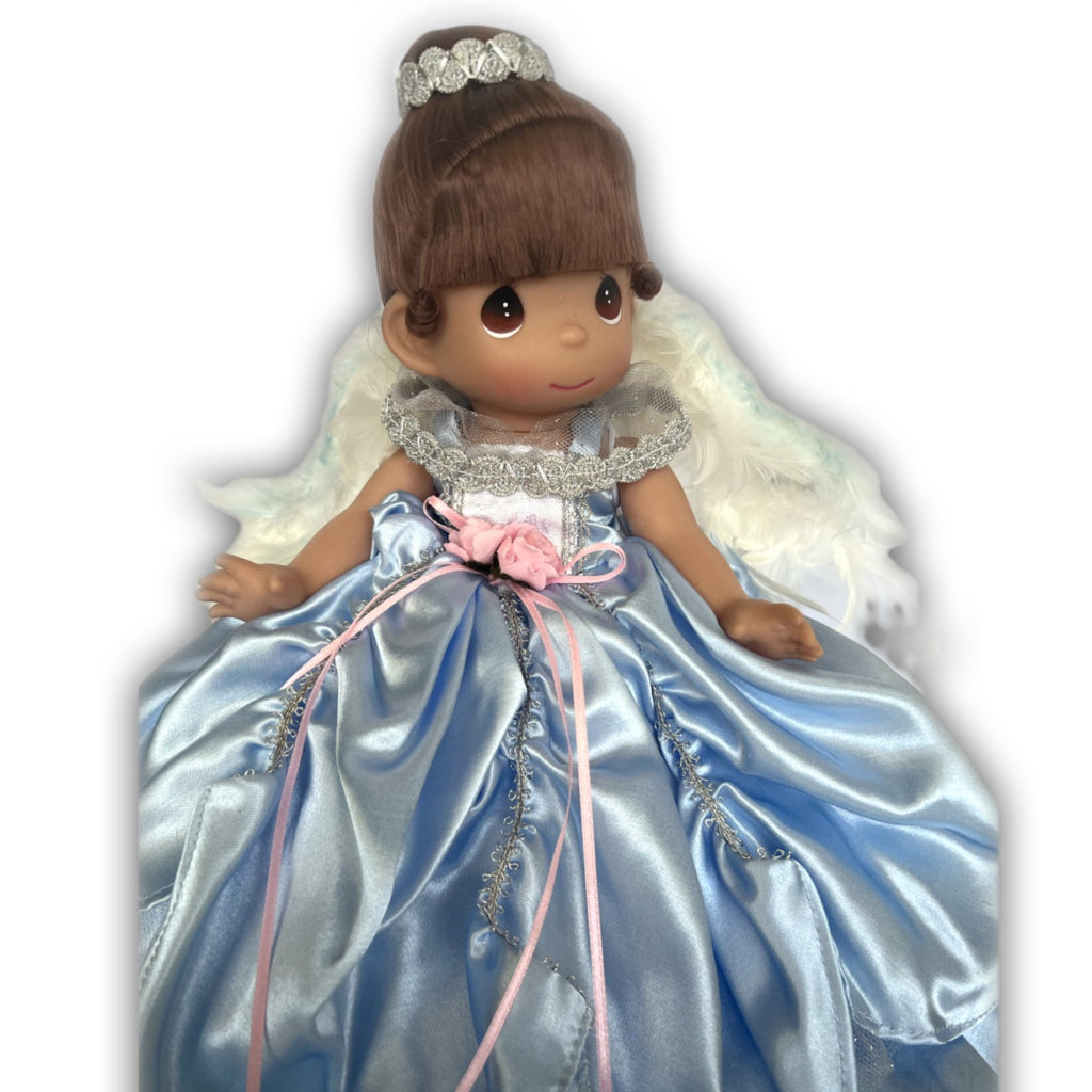 The Doll Maker 12-inch brunette angel doll wearing a blue satin gown with feather wings and silver trim