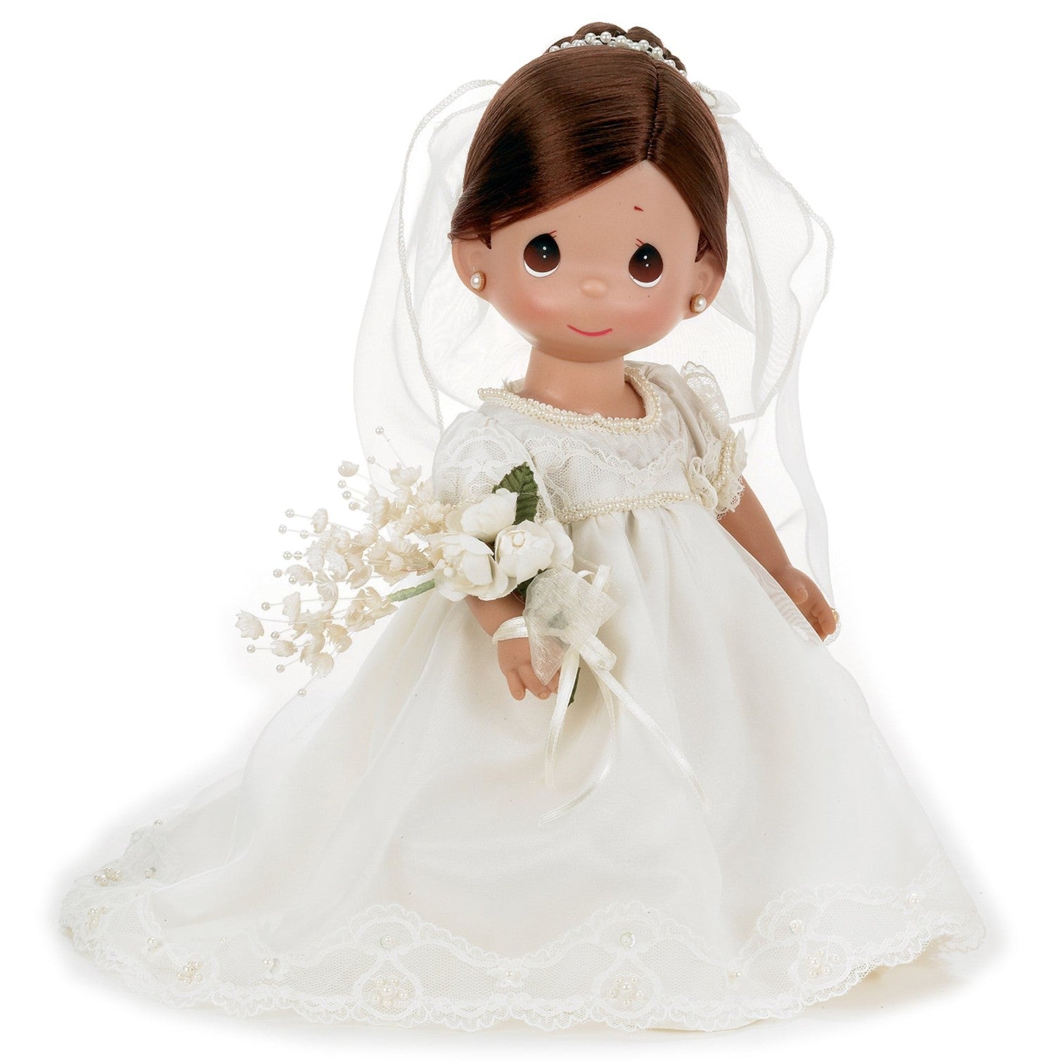 The Doll Maker Enchanted Dreams 12-inch brunette bride doll wearing a white wedding dress with veil and bouquet.