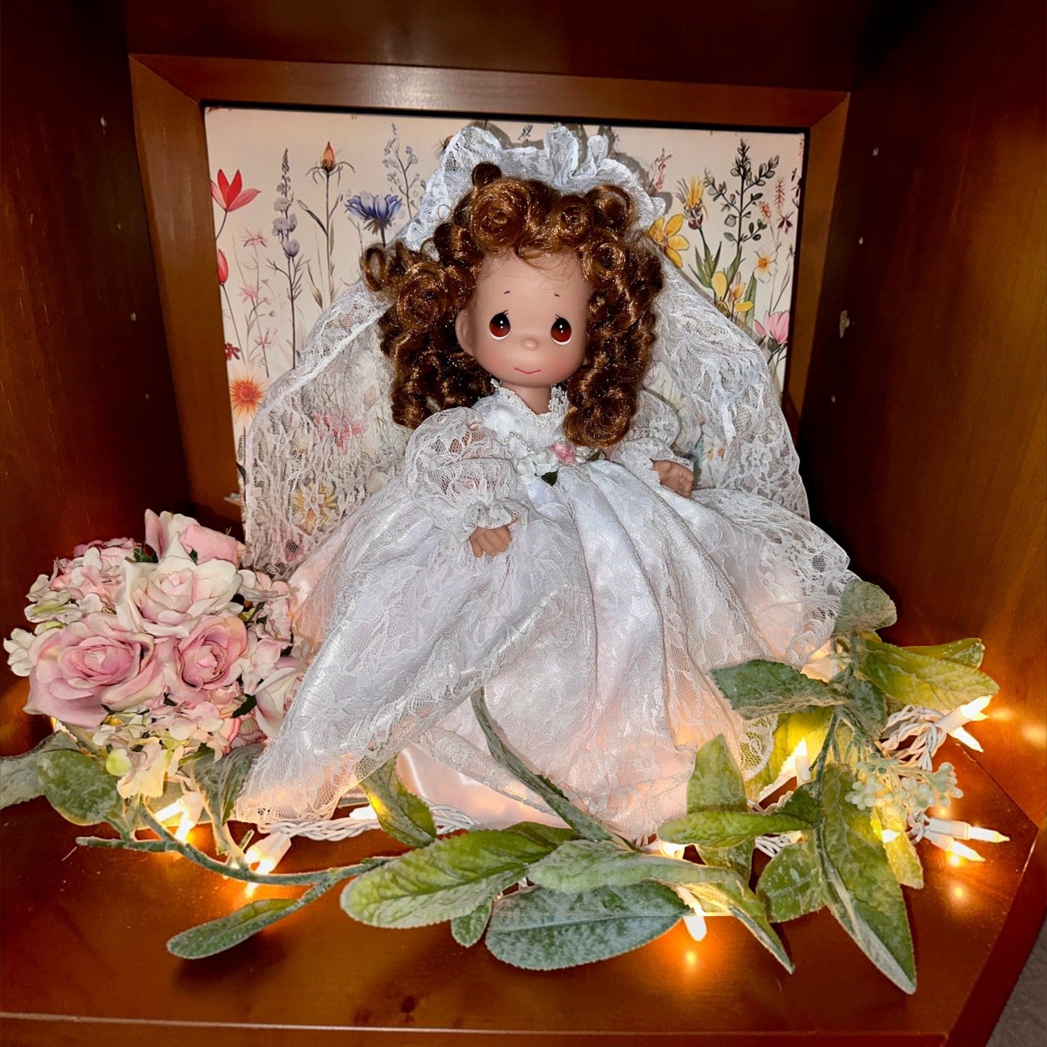 The Doll Maker Fairytale Come True 12-inch brunette bride doll wearing a white lace wedding dress and veil.