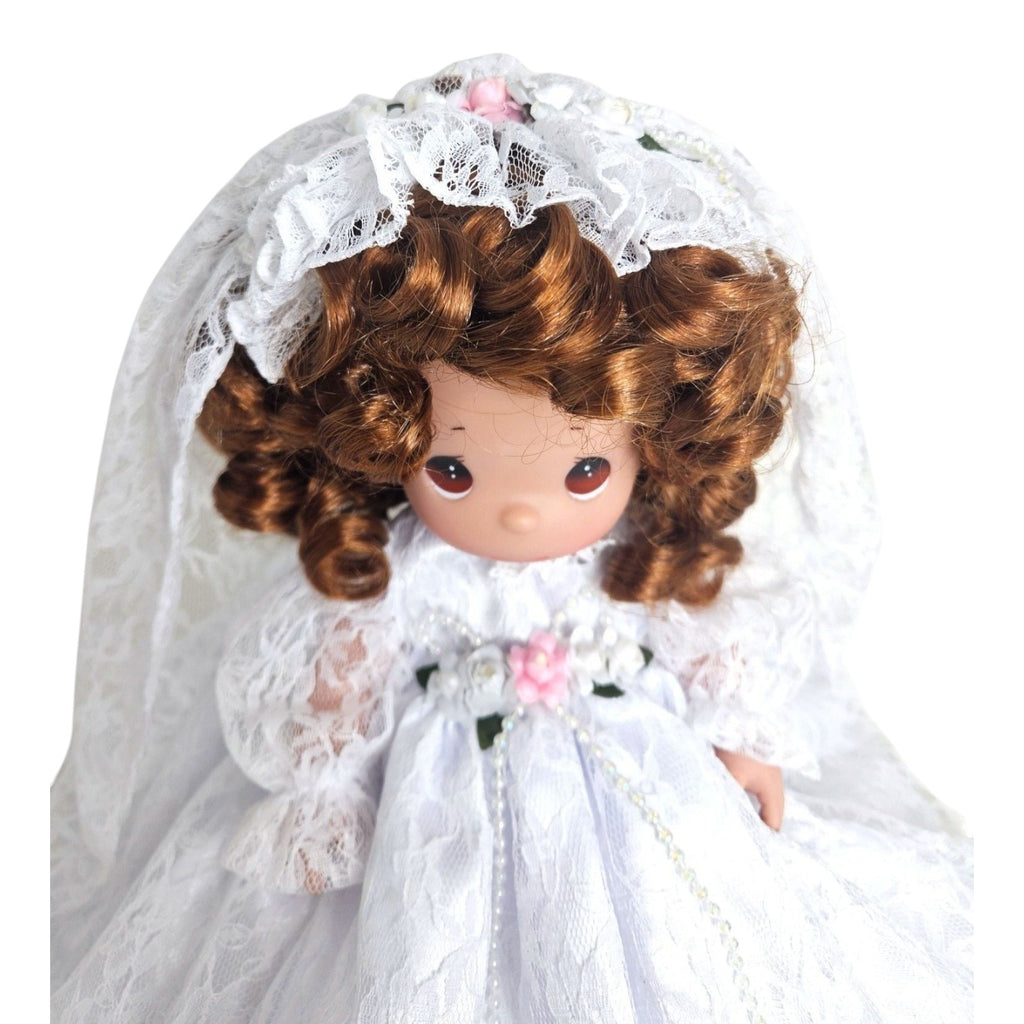 The Doll Maker Fairytale Come True 12-inch brunette bride doll wearing a white lace wedding dress and veil.