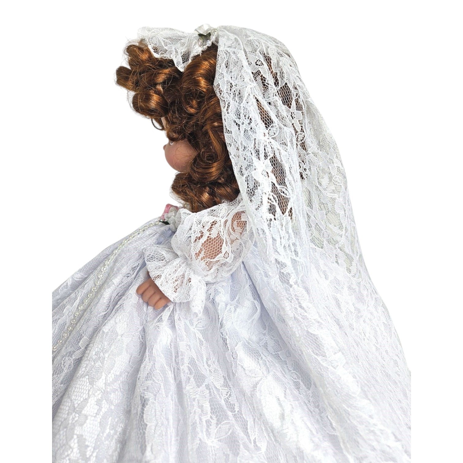 The Doll Maker Fairytale Come True brunette bride doll wearing a white lace wedding dress and veil, side profile.