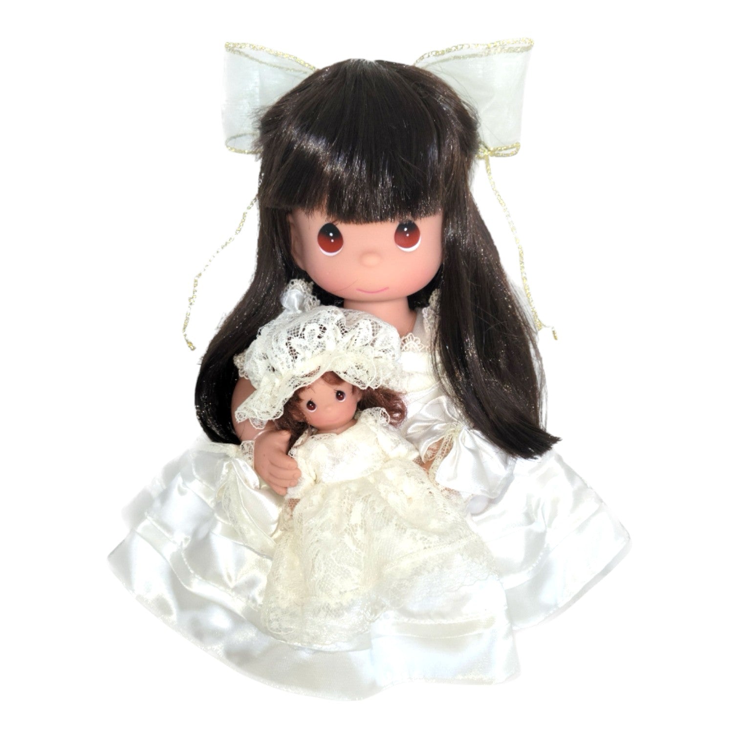 The Doll Maker A Mother’s Love 12-inch brunette vinyl doll wearing a white satin dress and holding a small doll.
