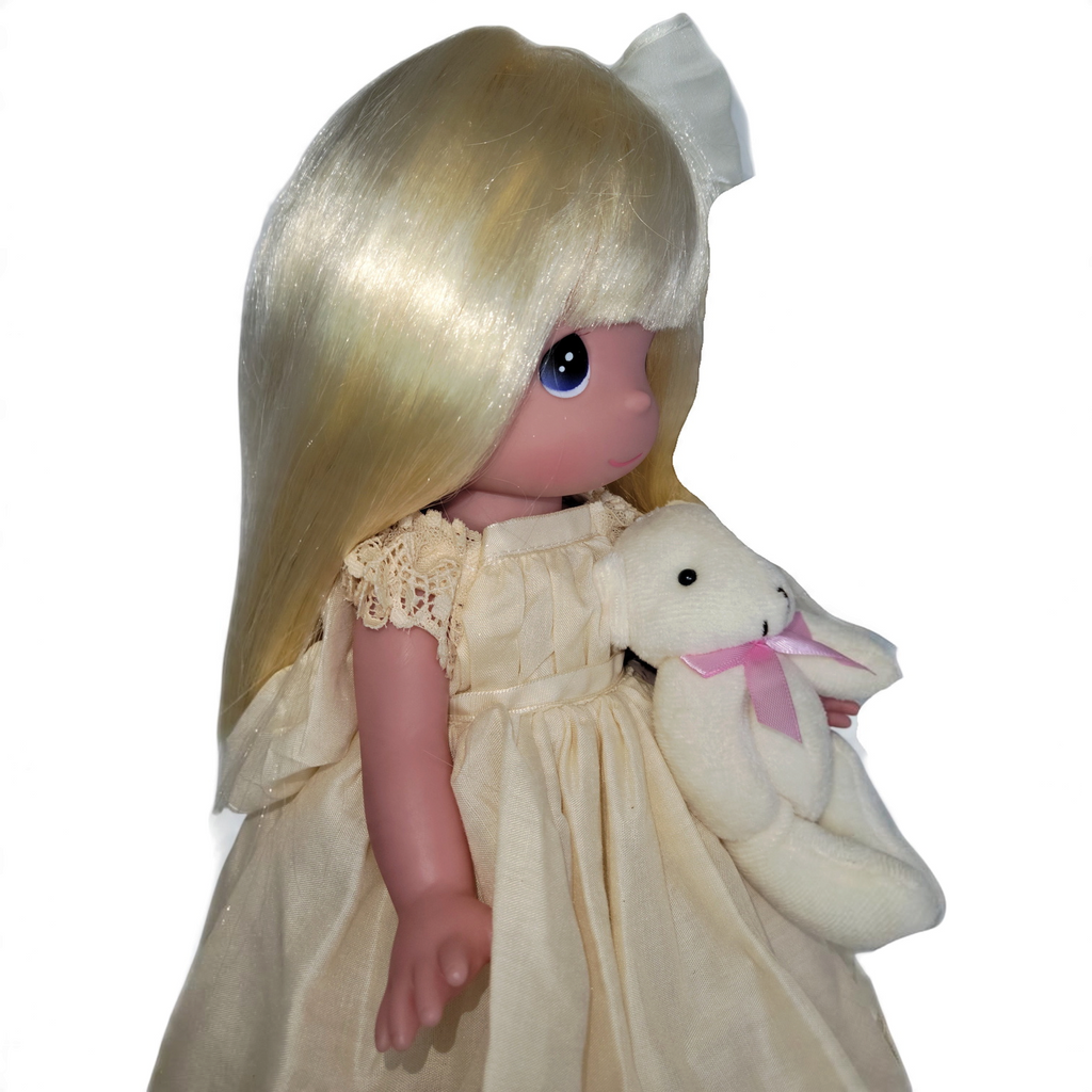 The Doll Maker Cherish Me Always 12-inch blonde vinyl doll wearing an ivory lace gown and holding a plush bear
