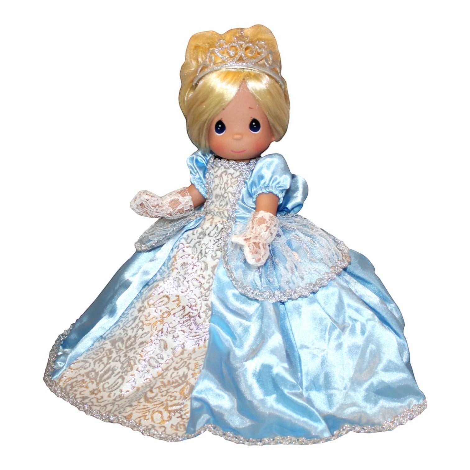 The Doll Maker Cinderella Elegance 12-inch doll wearing a blue satin ballgown with lace details and a silver tiara.