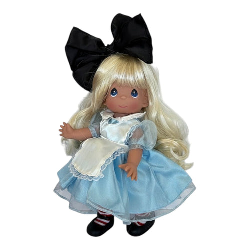 The Doll Maker 12-inch Classic Alice doll with blonde hair, black bow, and blue dress with white apron.
