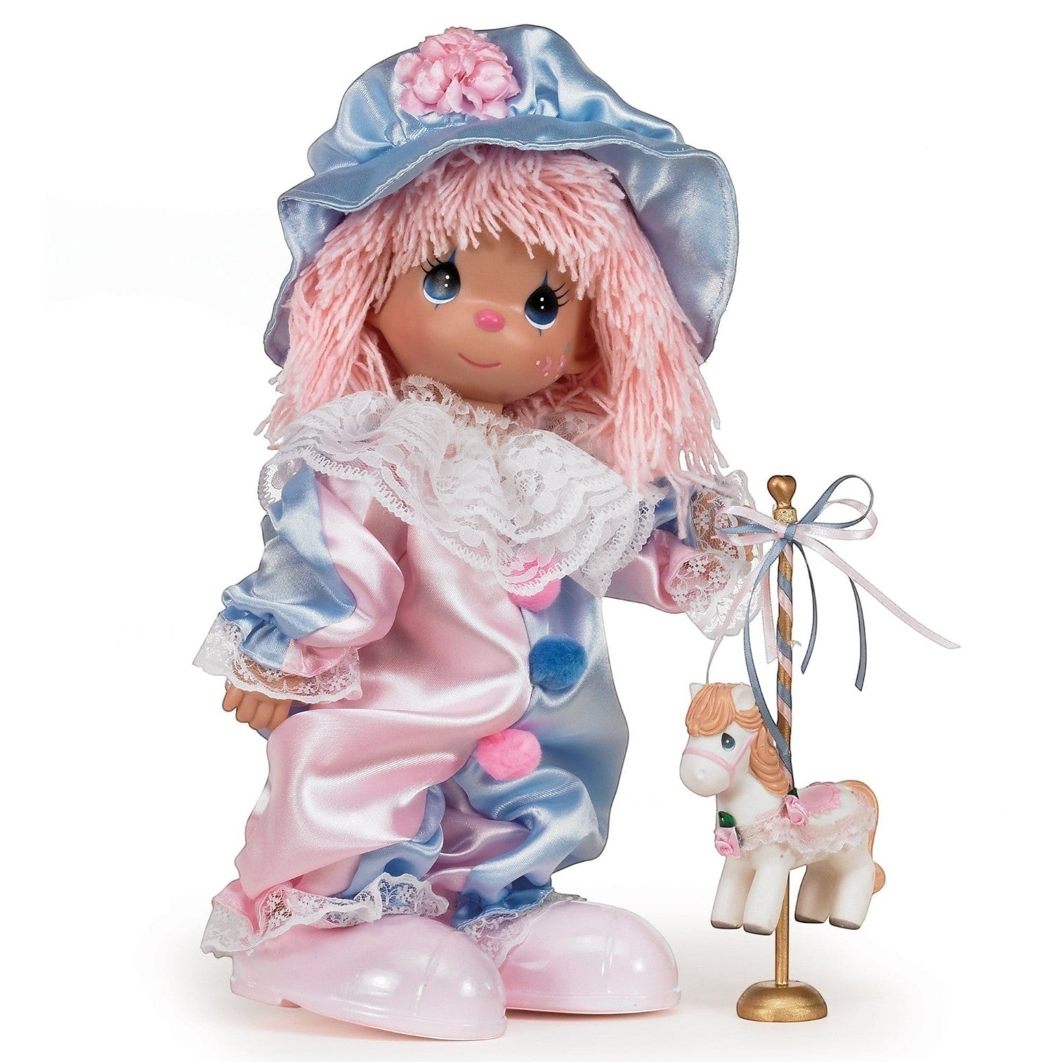 The Doll Maker 12-inch vinyl clown doll with pink yarn hair, blue and pink satin costume, and carousel horse accessory.