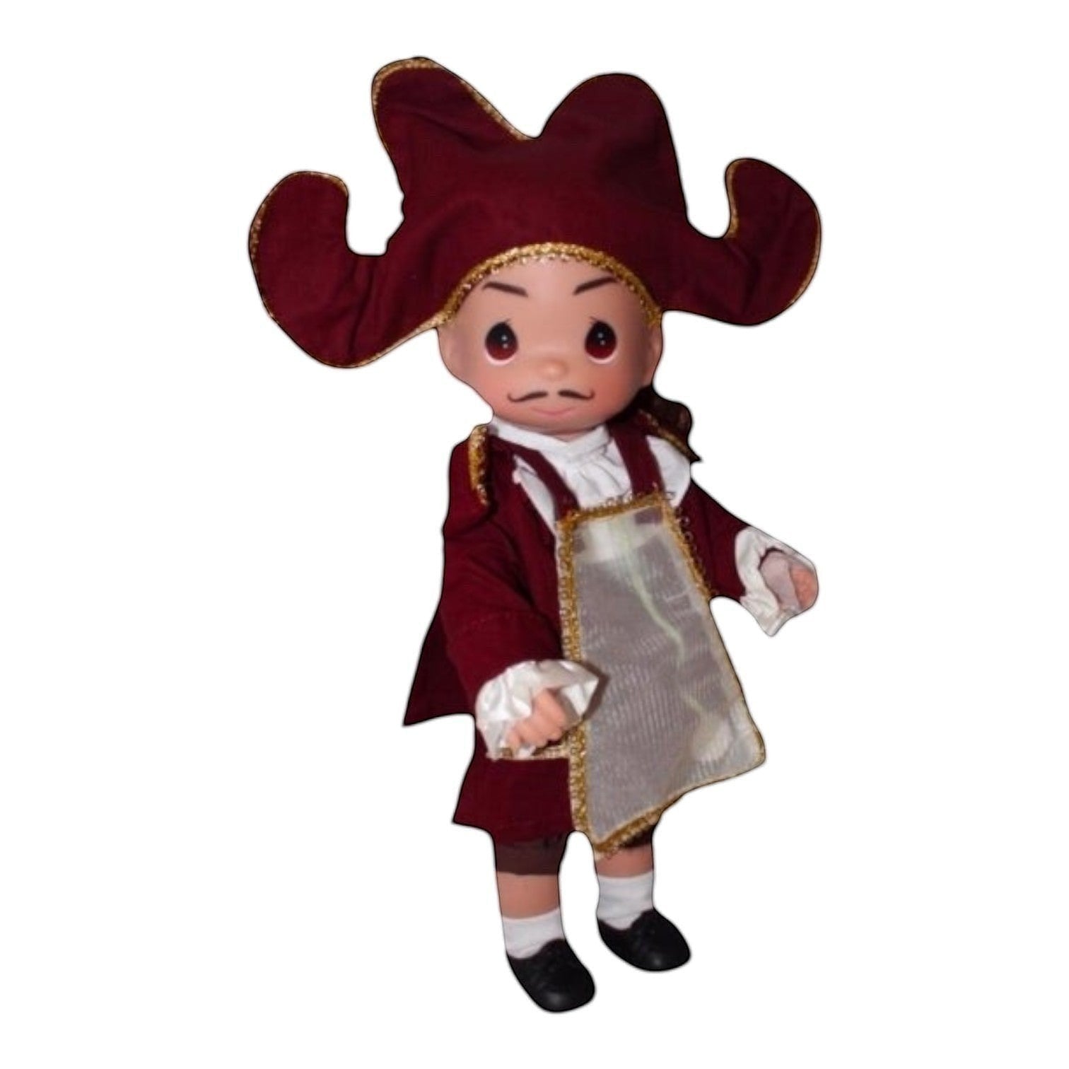 The Doll Maker’s 12-inch Cogsworth doll from Beauty and the Beast comes dressed in a charming outfit complete with a matching hat.
