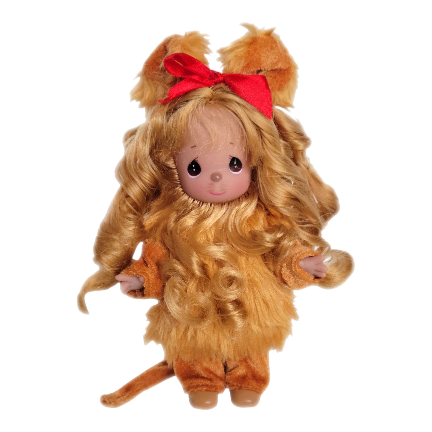 The Doll Maker 7-inch Cowardly Lion vinyl doll from The Wizard of Oz with curly blonde hair and a red hair bow.