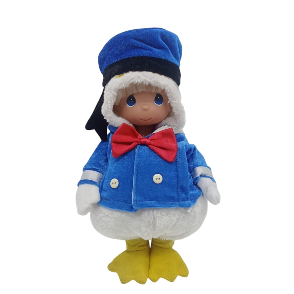 The Doll Maker 12-inch collectible vinyl doll in a Donald Duck outfits featuring a blue sailor jacket with a red bow tie and a blue hat